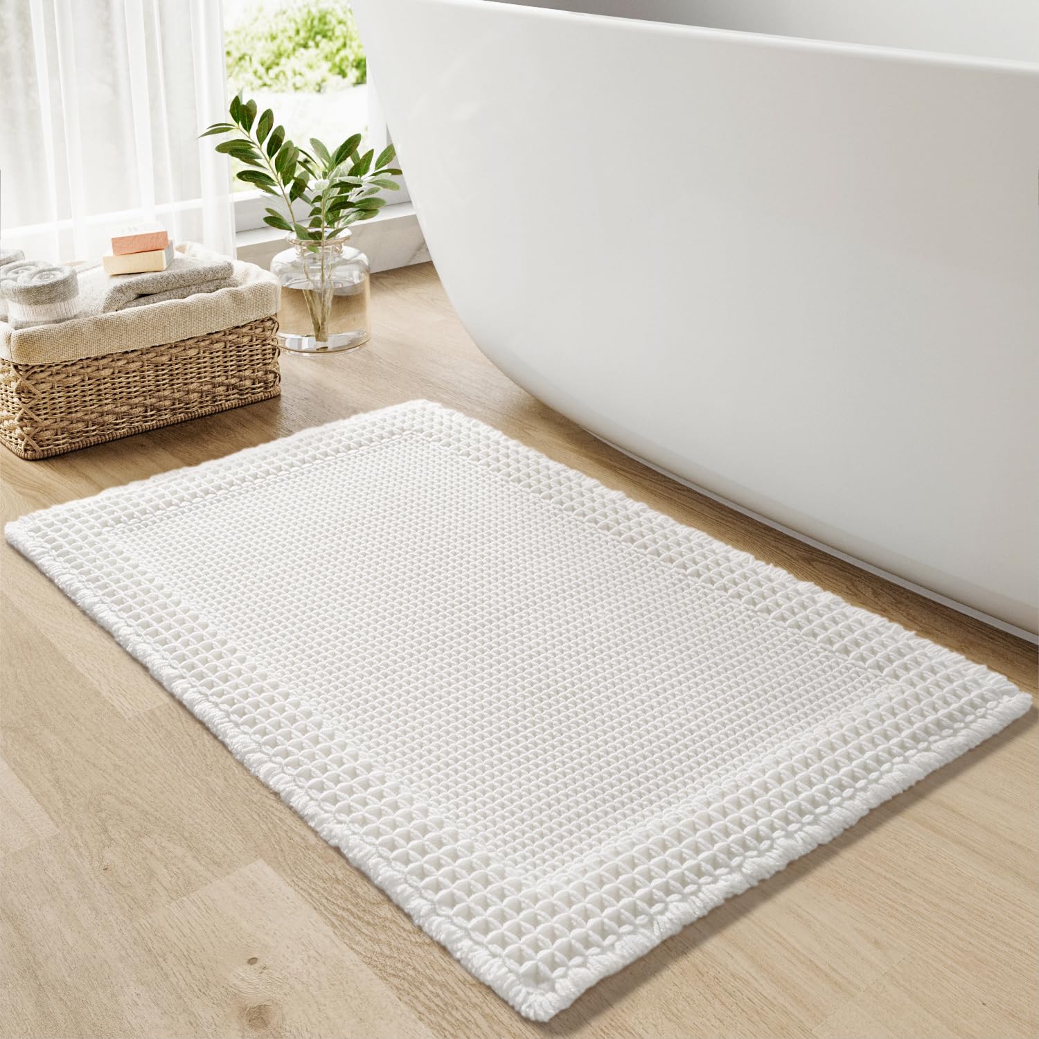 Photo 1 of RESARE Waffle Bath Mat for Bathroom, Super Absorbent Bathroom Rugs Non Slip Machine Washable, Ultra Soft Quick Dry Boho Bath Rugs with Tassels for Floor, Upgraded Bordered Design, 18"x30" White