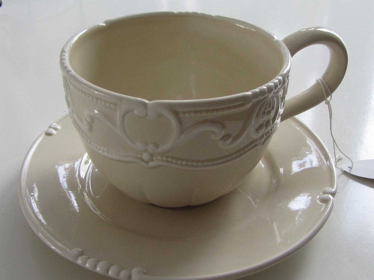 large coffee cup with saucer