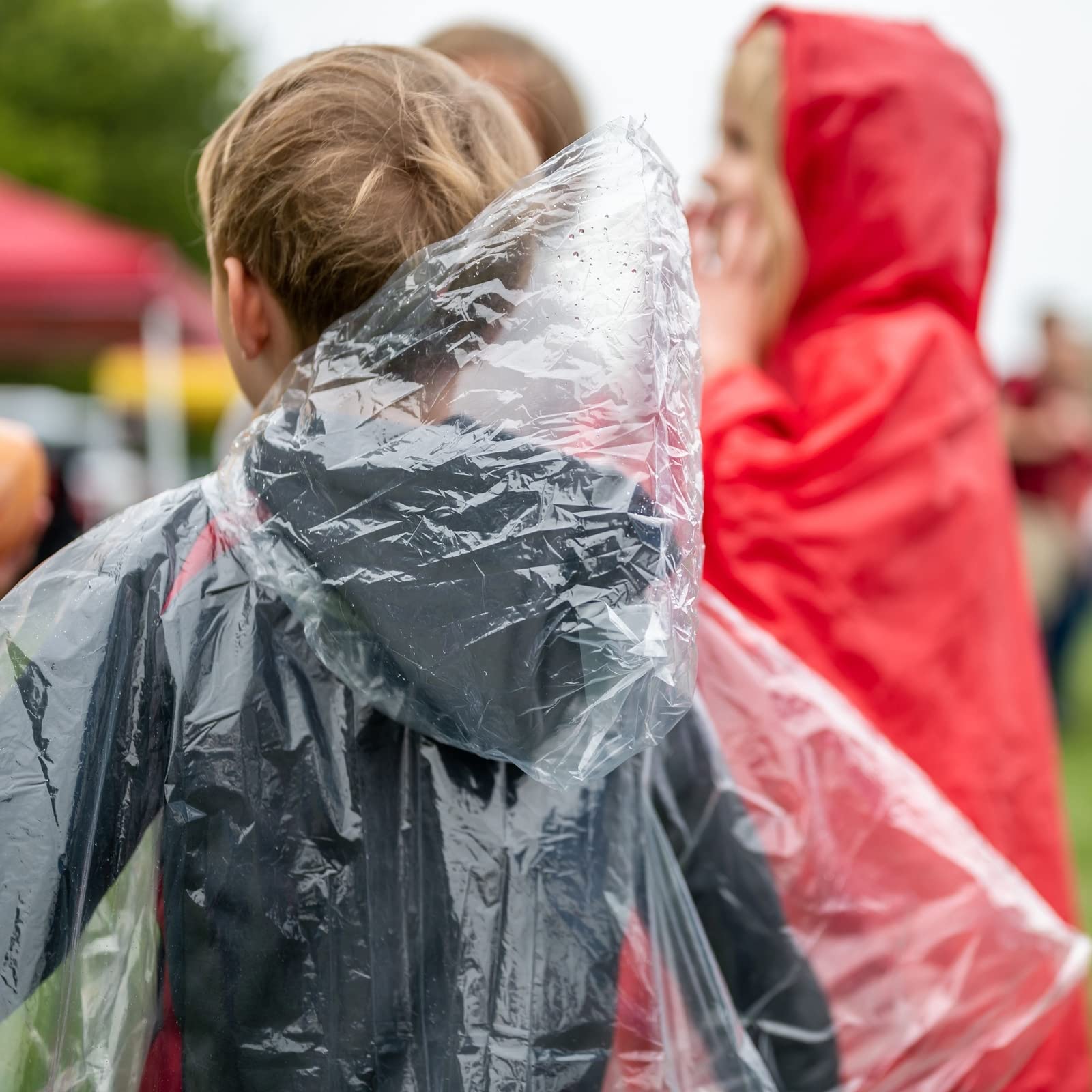 Juvale 10-Pack Disposable Rain Ponchos for Kids - Emergency Plastic Raincoats with Hood for Boys and Girls (Clear)