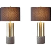 Signature Design by Ashley Jacek Contemporary Table Lamp Set of 2 | Textured faux concrete and brass-finished metal, Black drum shade with goldtone foil interior, Living room and bedside use