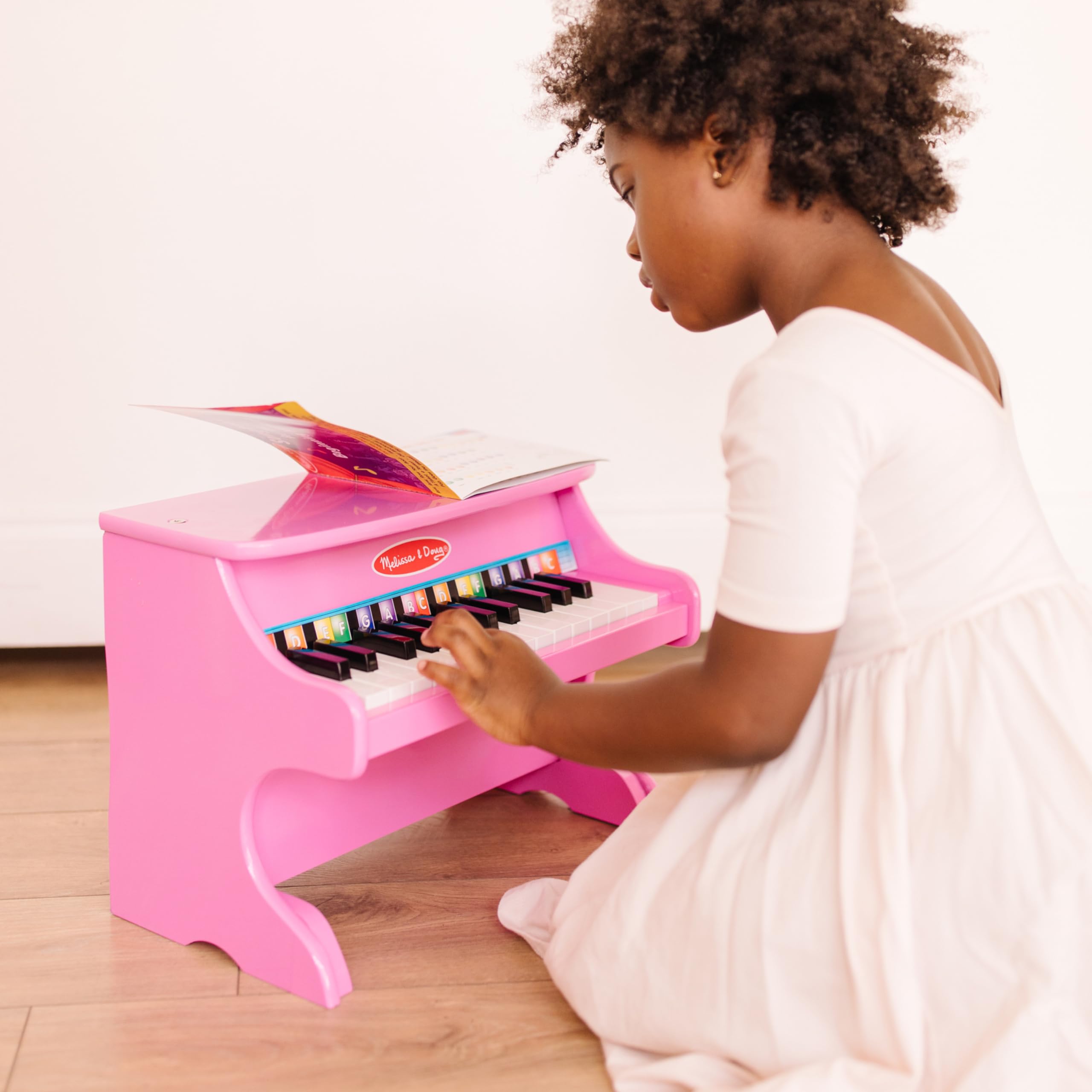 Melissa & Doug Learn-to-Play Pink Piano with 25 Keys and Color-Coded Songbook