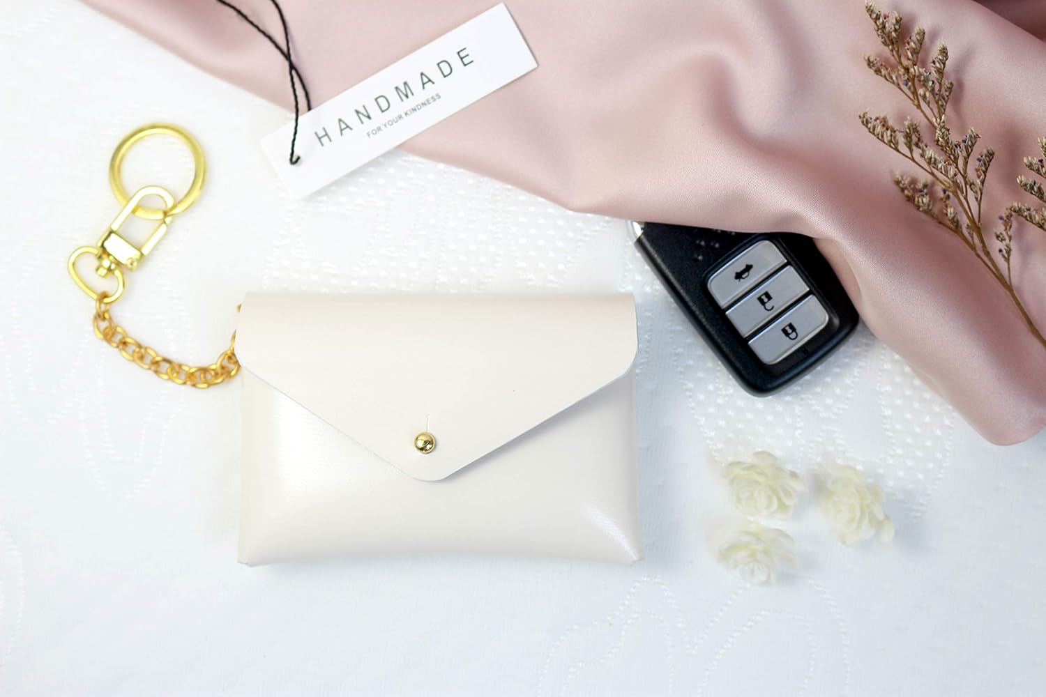 white keychain wallet