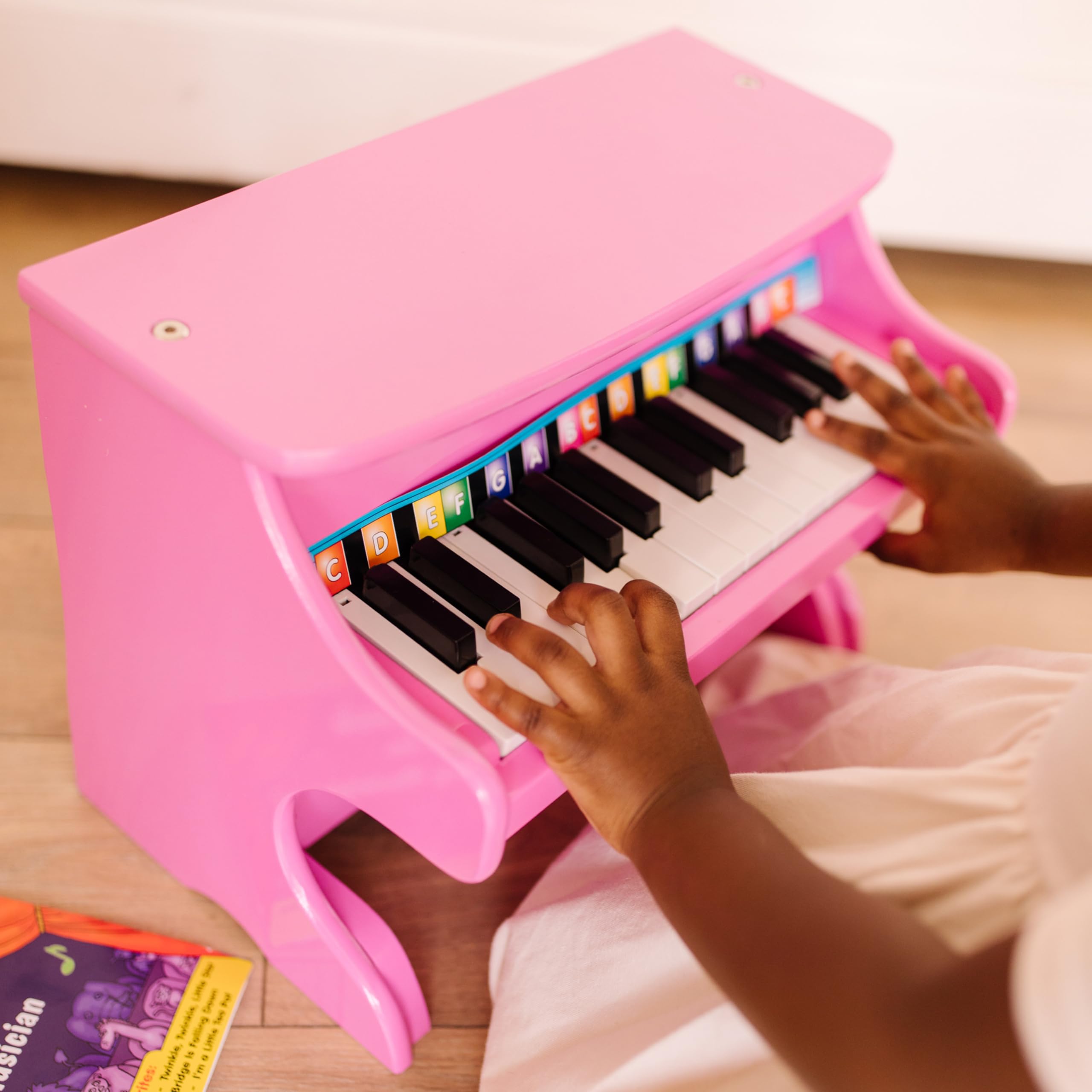 Melissa & Doug Learn-to-Play Pink Piano with 25 Keys and Color-Coded Songbook