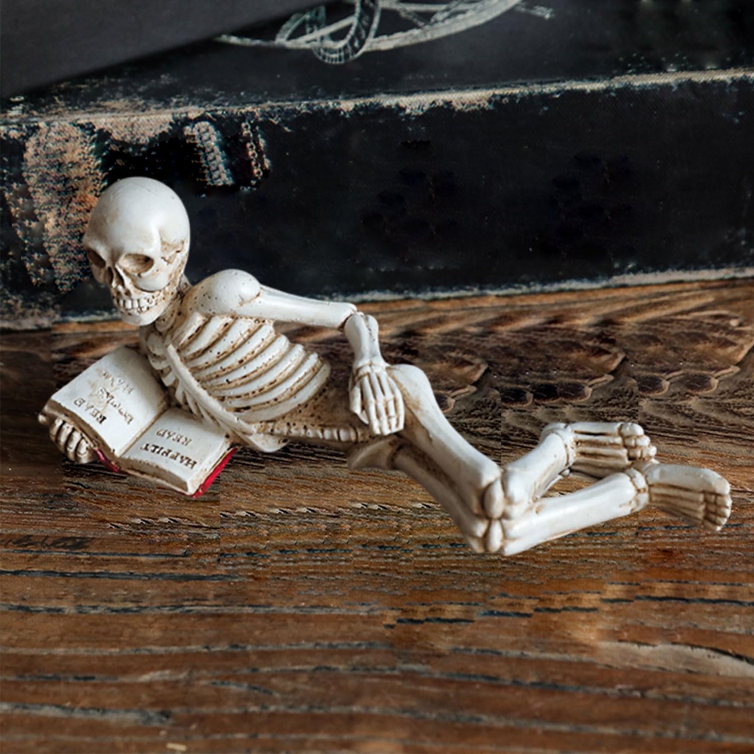 Photo 1 of 1 Pcs Halloween Statues Skeleton Take Book Evil Small Figurines with Legs Halloween Decorations Desk Decor Gothic Spooky Realistic Resin Skull Figurines Desk Ornament for Home Table Bookshelf Office