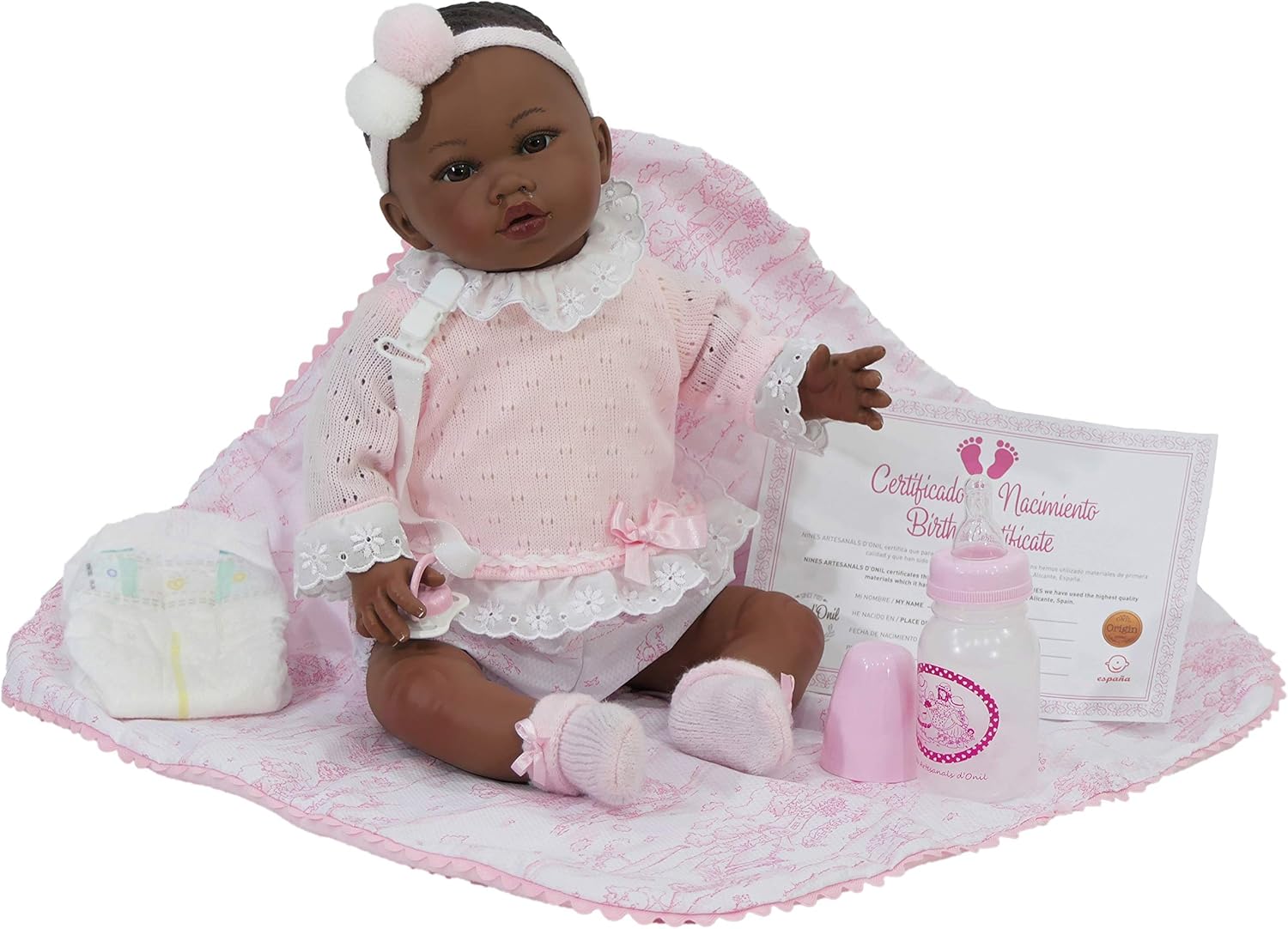 R/6435 Nines Reborn. Muñeca Reborn con Pelo y rasgos africanos. De 48 cm y 1,9 kg. con Detalles en Boca, Nariz y uñas, simulando un bebé Real. Accesorios incluidos. 100% Fabricado en España