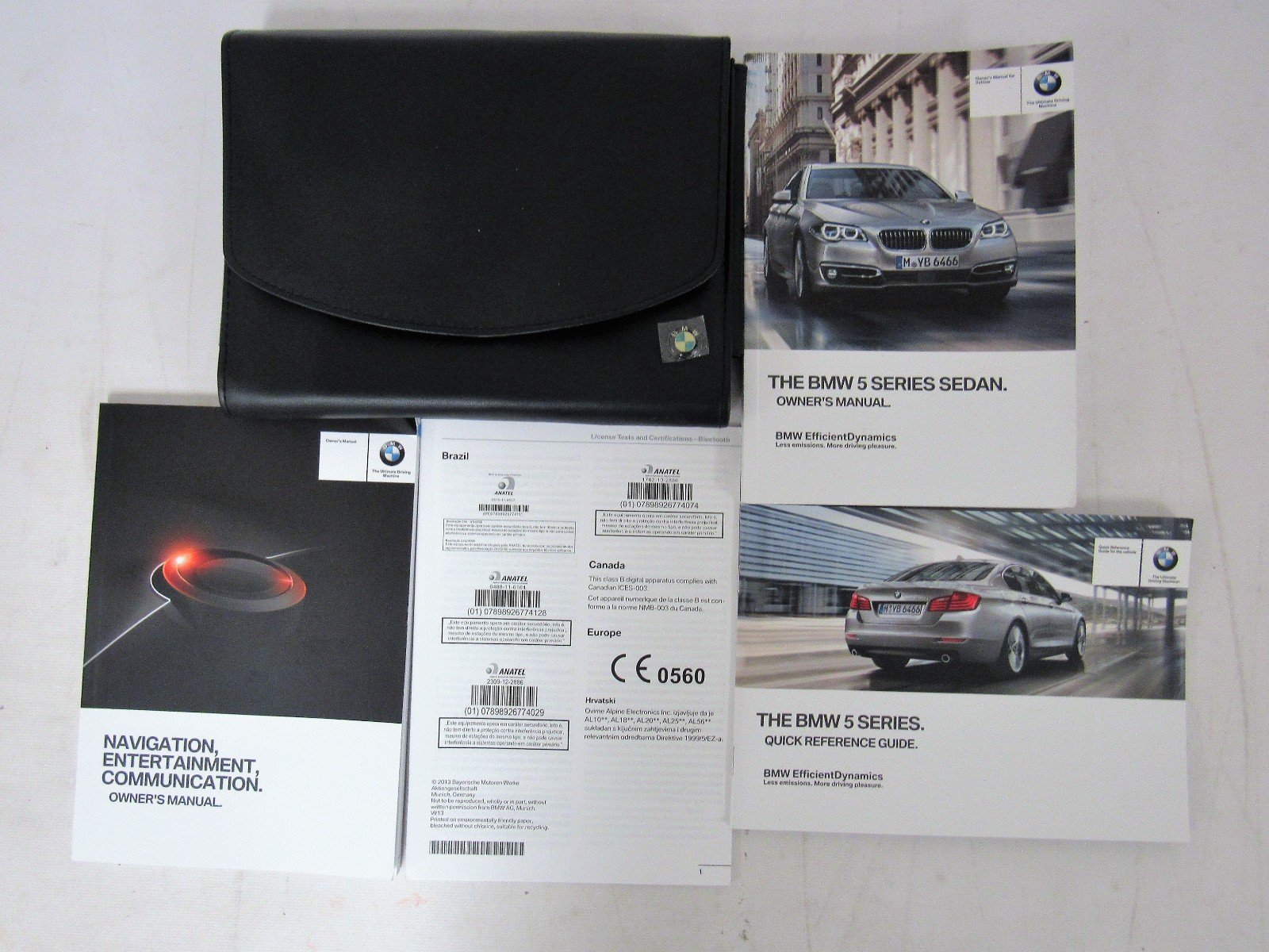 2014 BMW 5 SERIES SEDAN WITH NAVIGATION AND IDRIVE OWNER'S MANUAL Paperback  – 2014