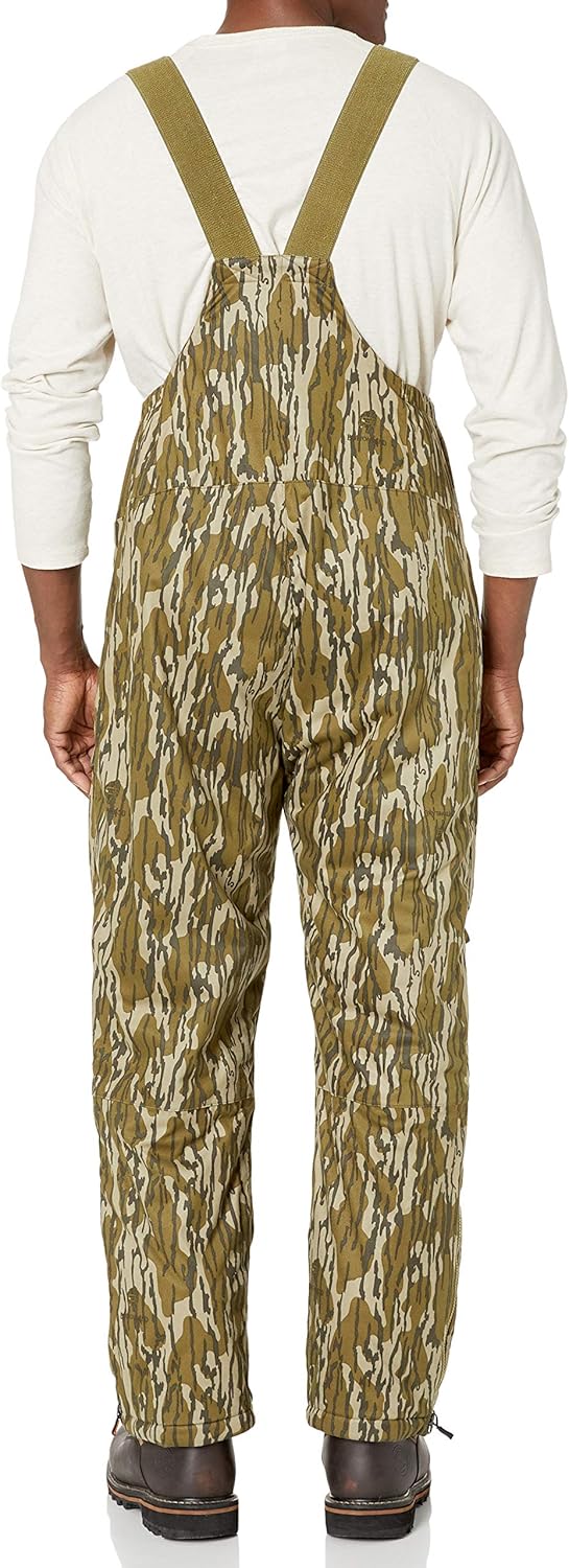 Nomad Mens Conifer Bib | Waterproof & Wind-Resistant Performance Camo Hunting Bib: Clothing