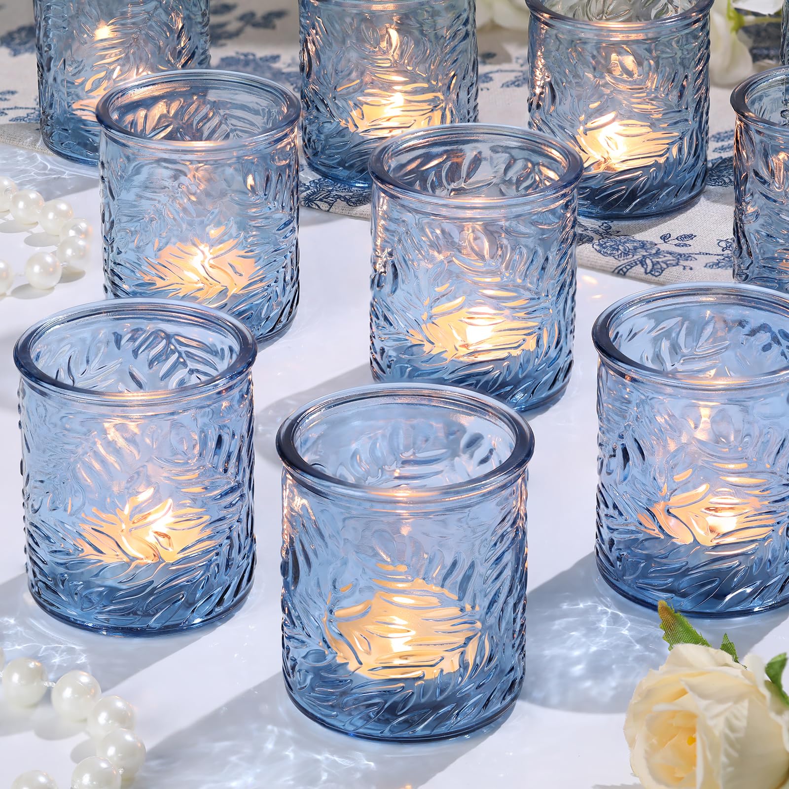 Photo 1 of HAVITI 24 pcs Blue Votive Candle Holders, Tea Light Candle Holder for Wedding Centerpieces, Glass Candle Holders for Baby Shower Home Bridal Decoration Table Decor