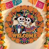 Putuo Decor Dia de los Muertos Skeleton Couple Welcome Wall Sign | Round MDF hanging sign with sugar skull couple, marigold wreath and butterflies. Reads Welcome for Day of the Dead.