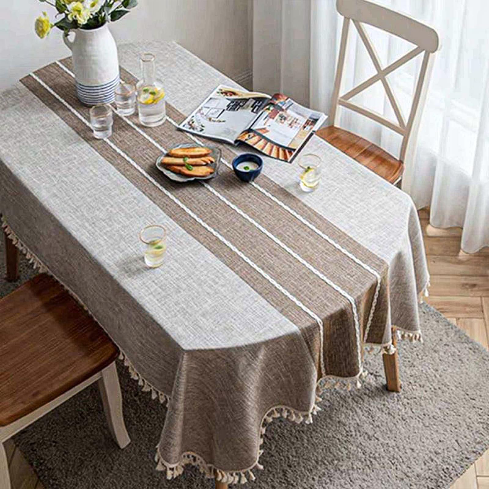 Photo 1 of JoraLion Boho Embroidery Oval Tablecloth with Tassel, Heavy Duty Cotton Linen Table Cloth Cover for Kitchen Dinning, Wrinkle Resistant (Coffee, 55" W x 84" L)