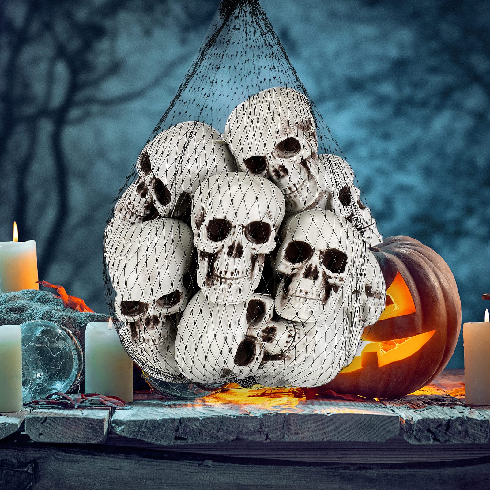 Photo 1 of 20 Pieces Mini Halloween Skulls Heads Plastic Miniature Skulls Skeleton Heads Decorations in Mesh Bag Realistic Props Crafts for Halloween Party Bar Home Table Decor