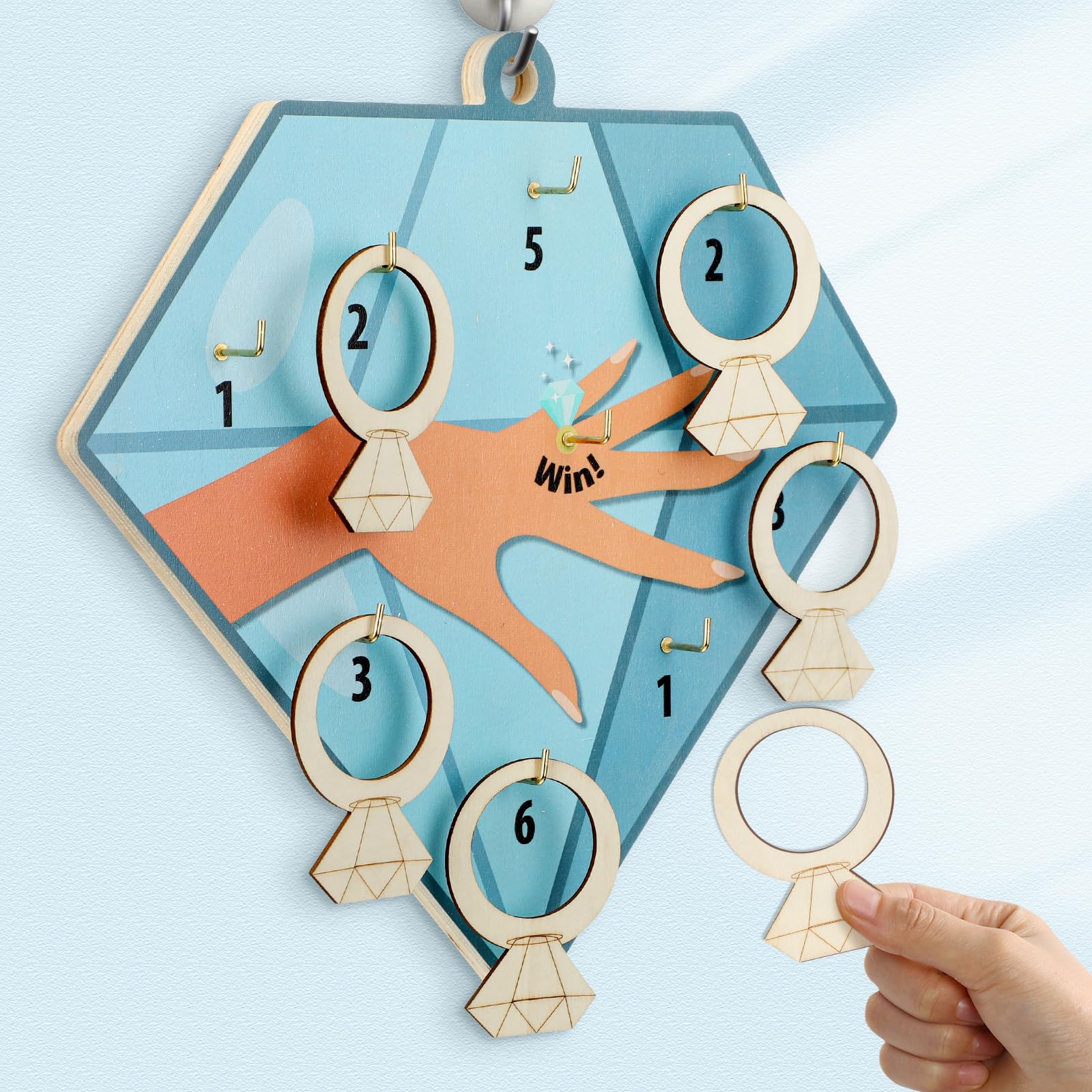 Photo 1 of Foilswirl 28 Pcs Bridal Shower Game Ring Toss Bridal Shower Game Set Include 1 Diamond Board 15 Wooden Diamond Rings 12 Hooks for Wedding Engagement Bachelorette Party Favors