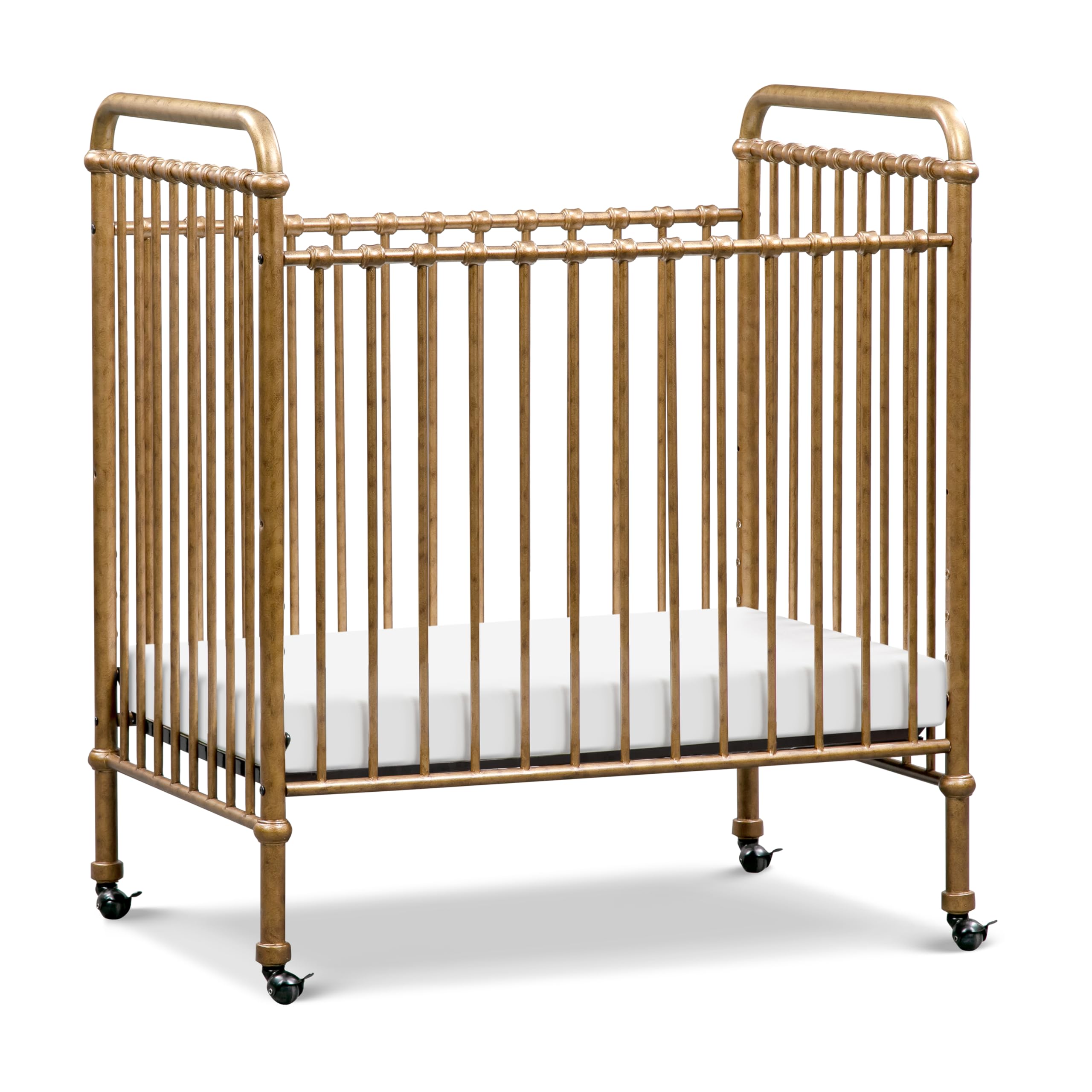 Photo 1 of NAMESAKE Abigail 3-in-1 Portable Baby Crib with Wheels - GREENGUARD Gold Certified Convertible Crib to Toddler Bed & Daybed - Metal Baby Bed w/ 4 Adjustable Mattress Heights, for Small Spaces - Gold