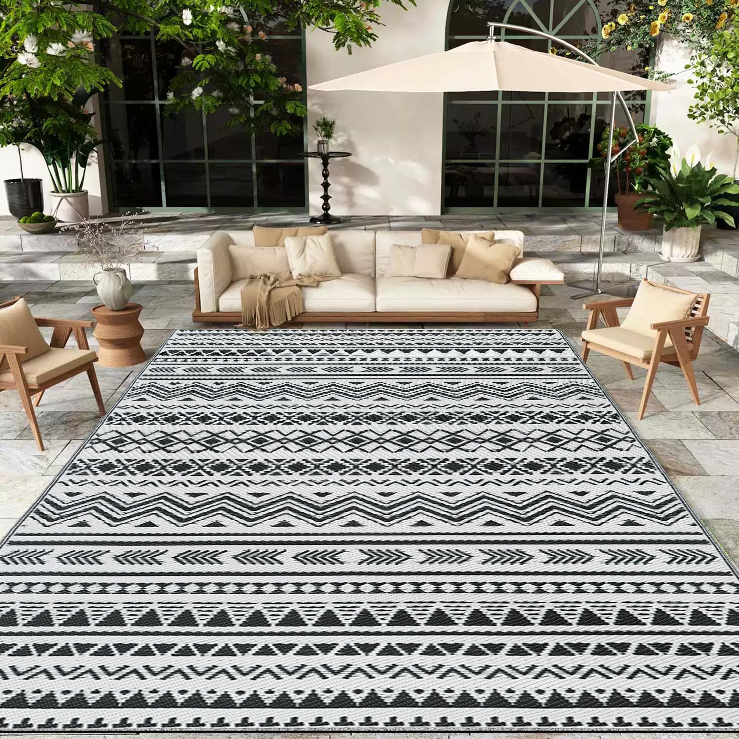 Photo 1 of WILDROOTS 6x9 Feet Black and White Plastic Outdoor Rug, Stain Resistant Waterproof Reversible Outdoor Patio Rug, Fade Resistant Camping Rug