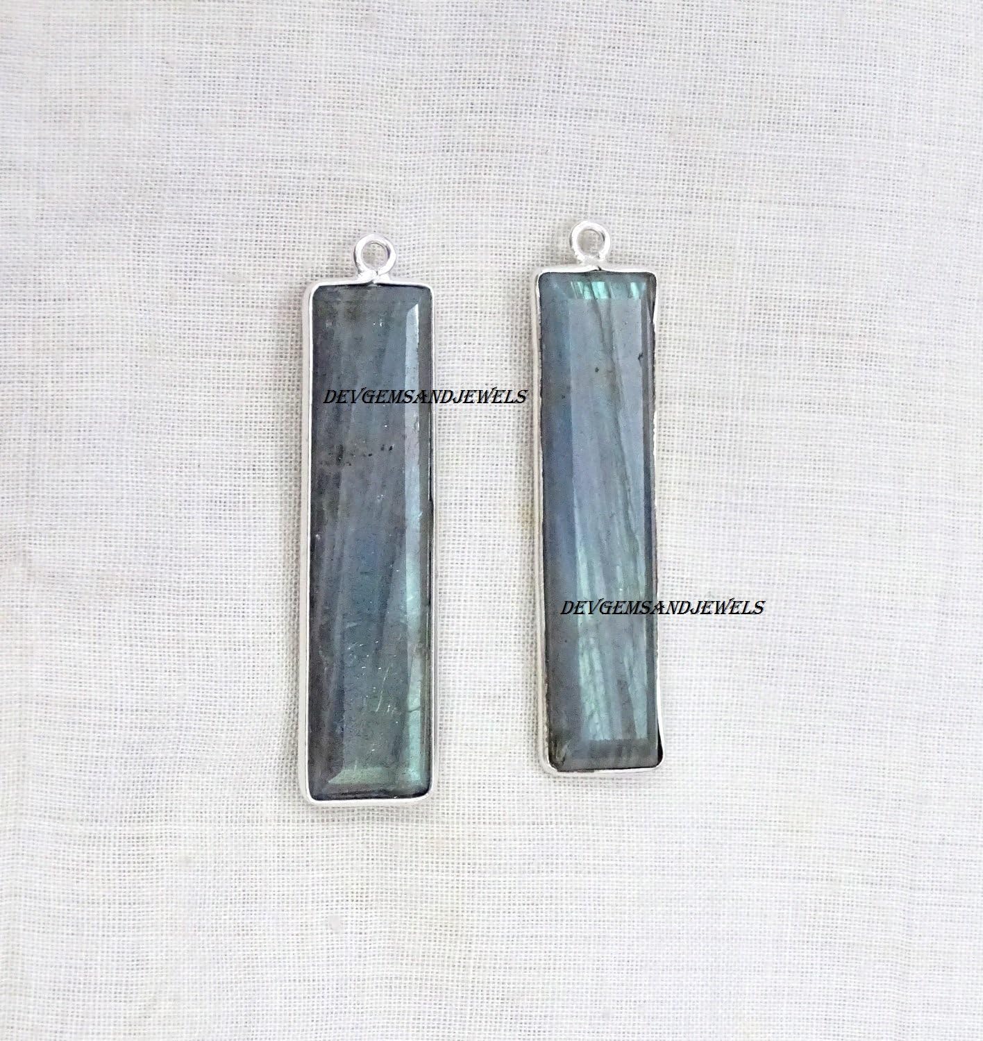 Devgemsandjewels 2 Pcs Lot Natural Labradorite Beautiful Elongated Rectangle 34 X 8 mm Approx Faceted Bezel 925 Silver Plated Single Bail Gemstone Charm Pendant - in Wholesale Price.