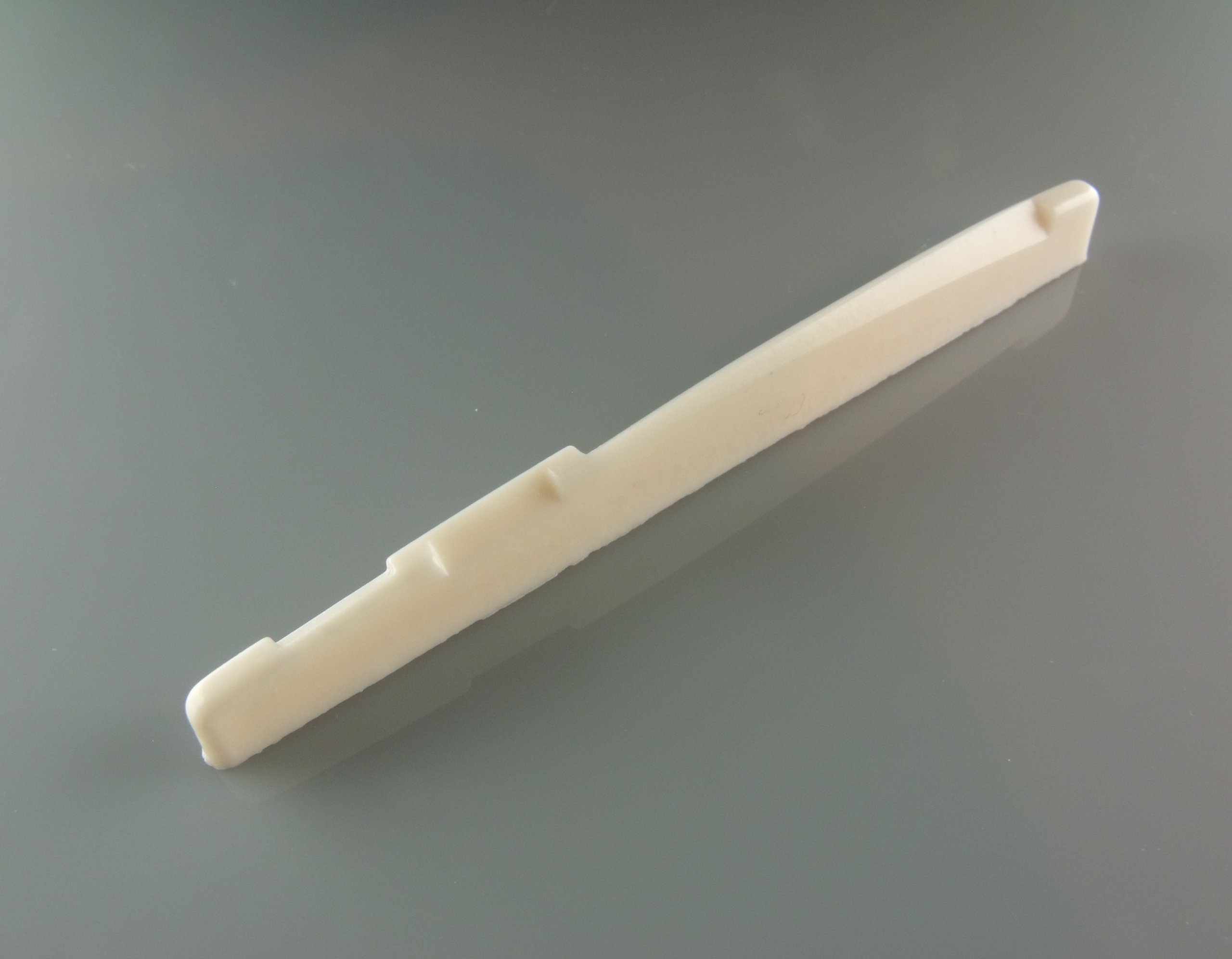 Acoustic guitar saddle 74mm wide 7.9mm high white nylon