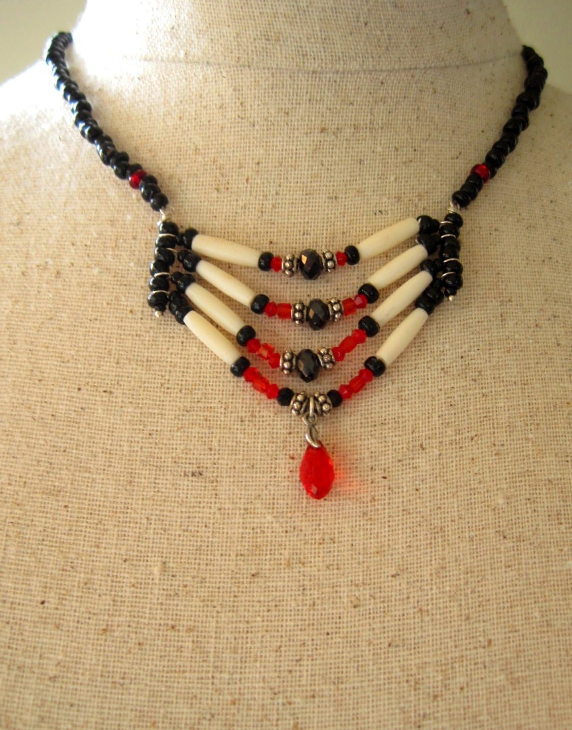 Macabre Tribal hair pipe bone breast plate protection choker. Red and Black sparkles, crystals and beads compliment beautiful vintage pony beads.