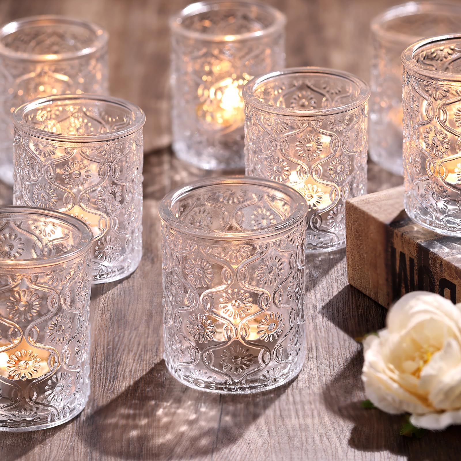 Photo 1 of Volens 24pcs Clear Votive Candle Holders for Table Centerpiece, Vintage Flower Glass Tealight Candle Holders Bulk for Wedding Decorations, Boho, Home and Party Decor