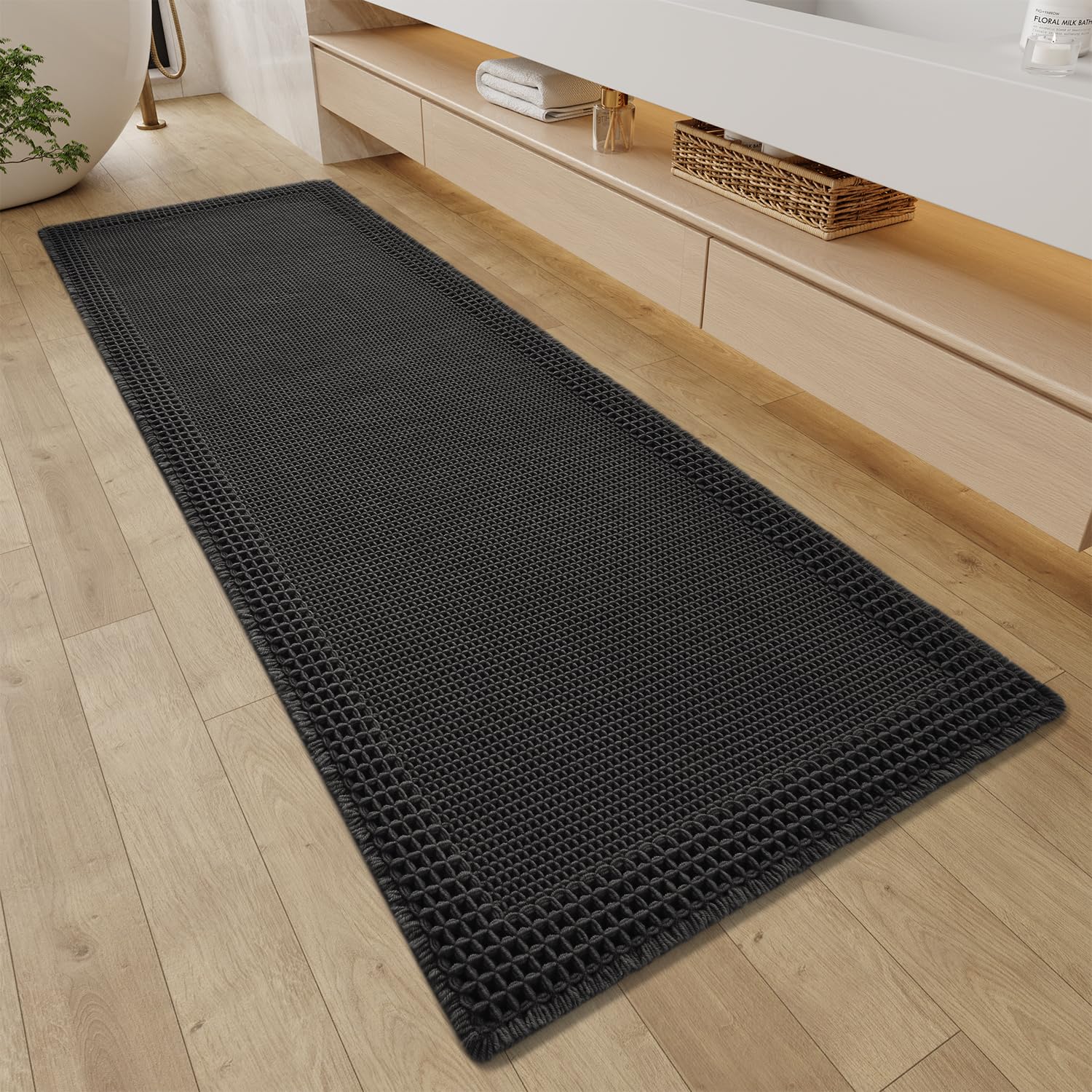 Photo 1 of RESARE Waffle Bathroom Runner Rugs, Super Absorbent Bath Mat Non Slip Washable Quick Dry, Upgraded Ultra Soft Boho Bath Rugs with Tassels for Hallway Bedroom Laundry Room, 2'x6'(24"x72"), Black