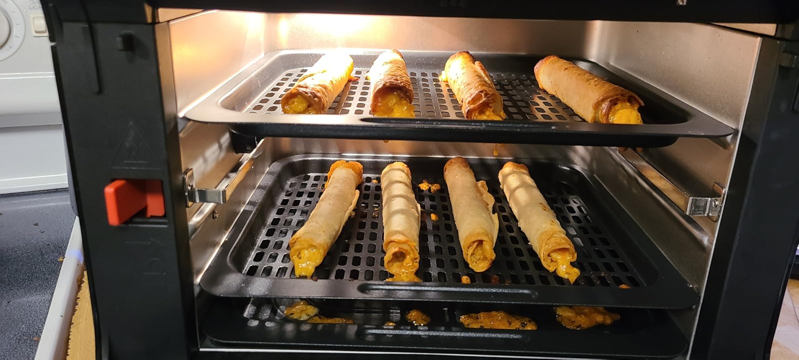 Smells like burning plastic/chemicals, not really a toaster oven