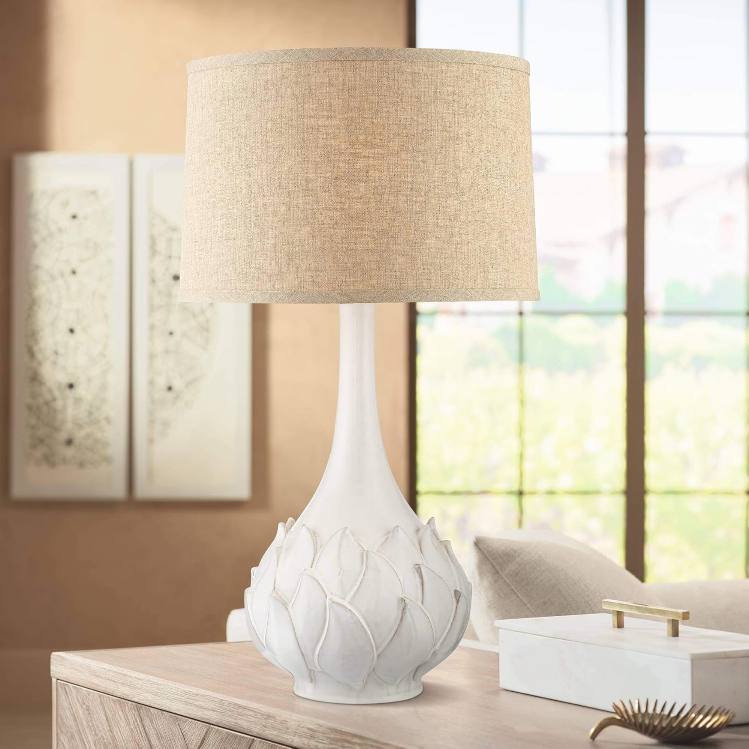 white ceramic lamp with flower on base