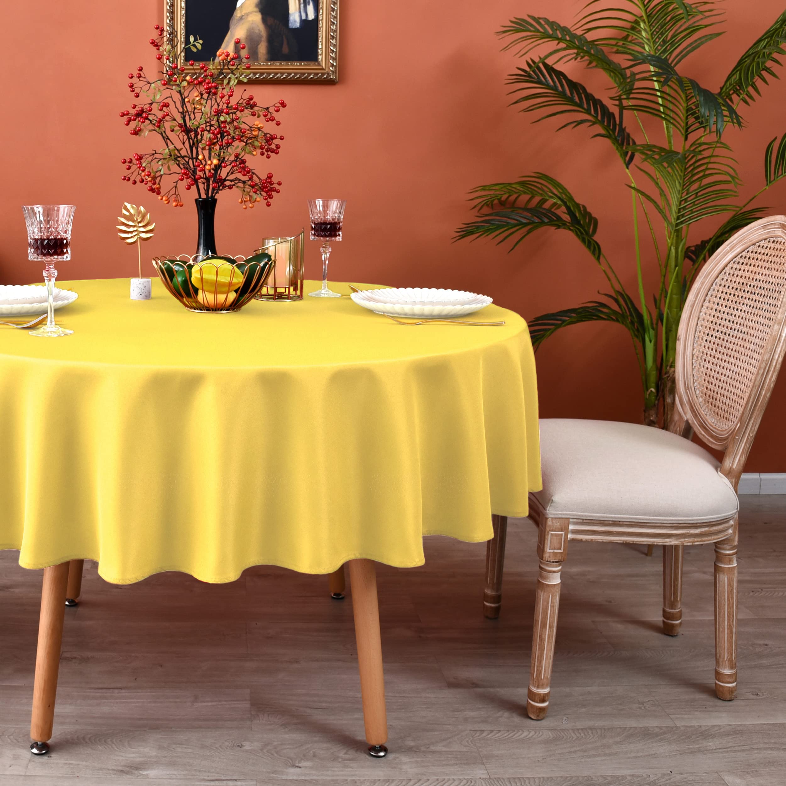 Photo 1 of MEANMOY Yellow 210 GSM Water & Stain Resistant Round Tablecloth for Circle Table - Solid Small 48 Inch Table Cloth Cover in Wrinkle Free Durable Washable Polyester Fabric for Wedding, Party, Banquet