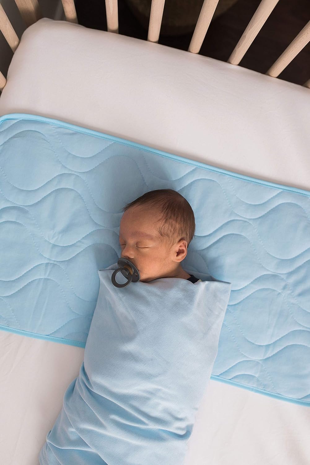 crib sheet saver pad