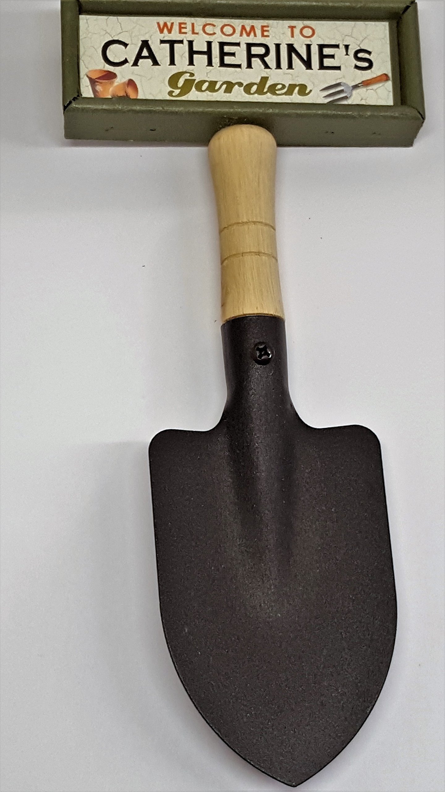 "Welcome to Charlie's garden" hanging shovel sign