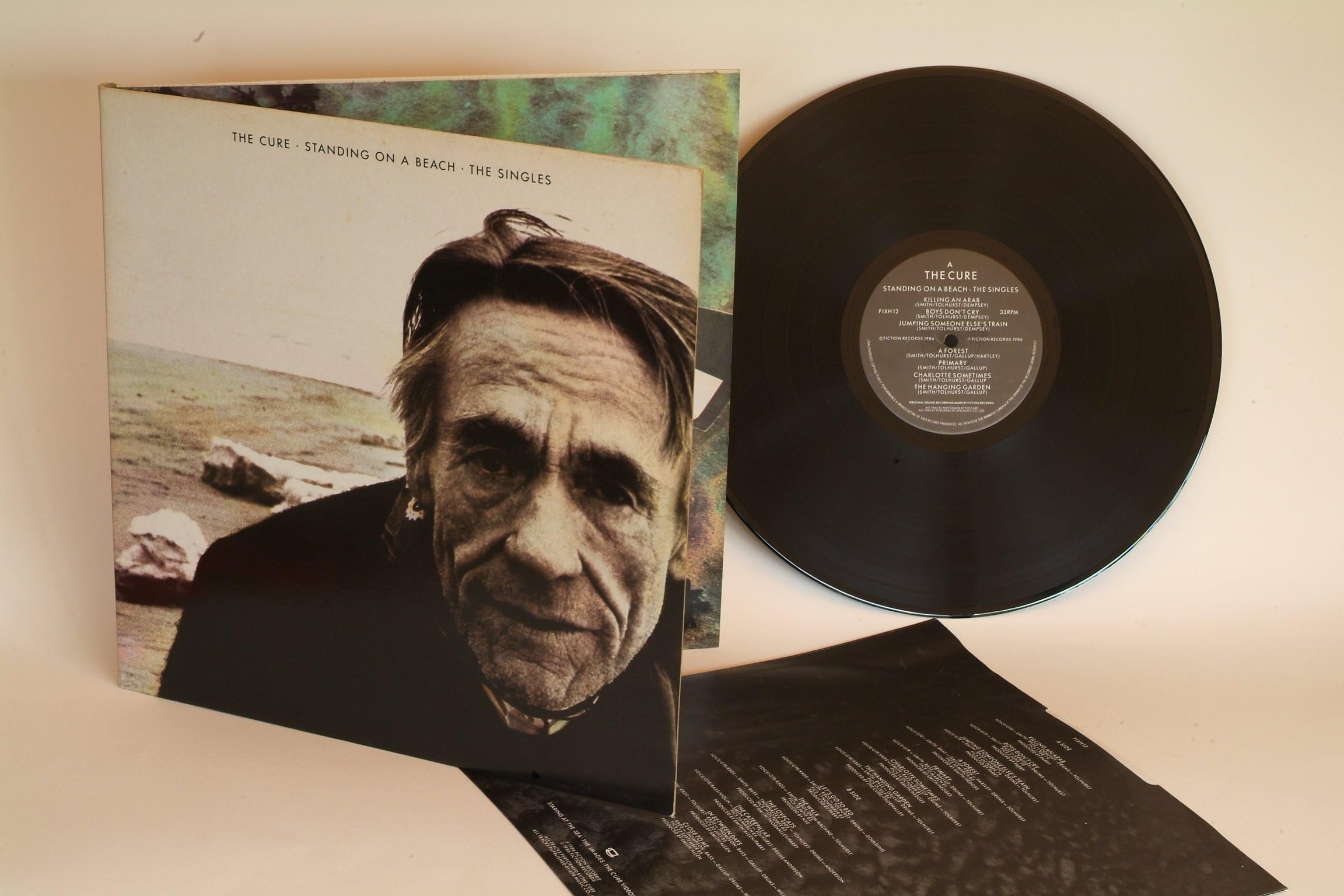 THE CURE standing on a beach the singles. First UK press, hand written matrix AND BACK AGAIN ARUN, 1986 on Fiction records.