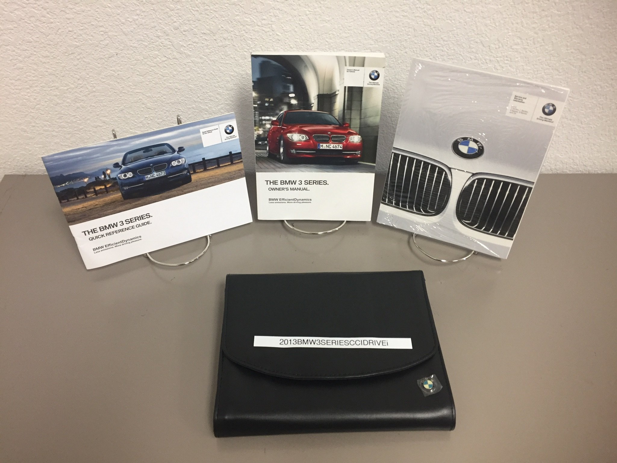 2013 BMW 3 SERIES OWNER'S MANUAL SET FOR ALL COUPE & CONVERTIBLE MODELS  WITH NAVIGATION Paperback – Box set, 2013