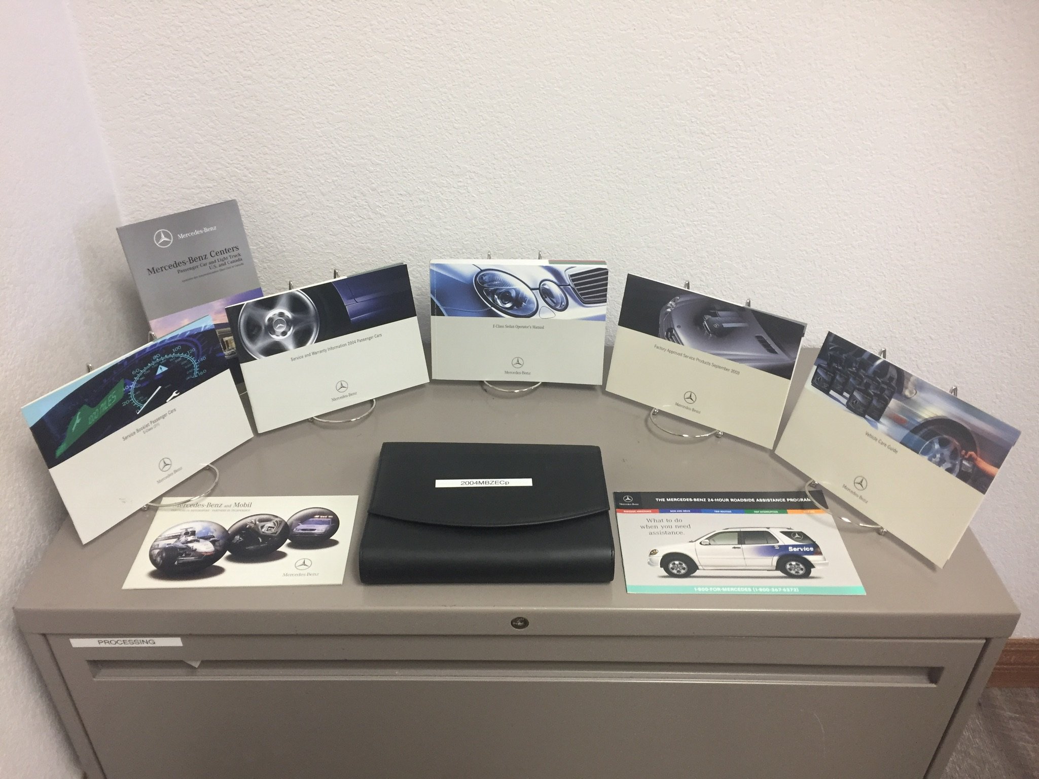 2004 MERCEDES-BENZ E320 E500 E55 AMG OWNERS MANUAL SET Paperback – Box set,  2004