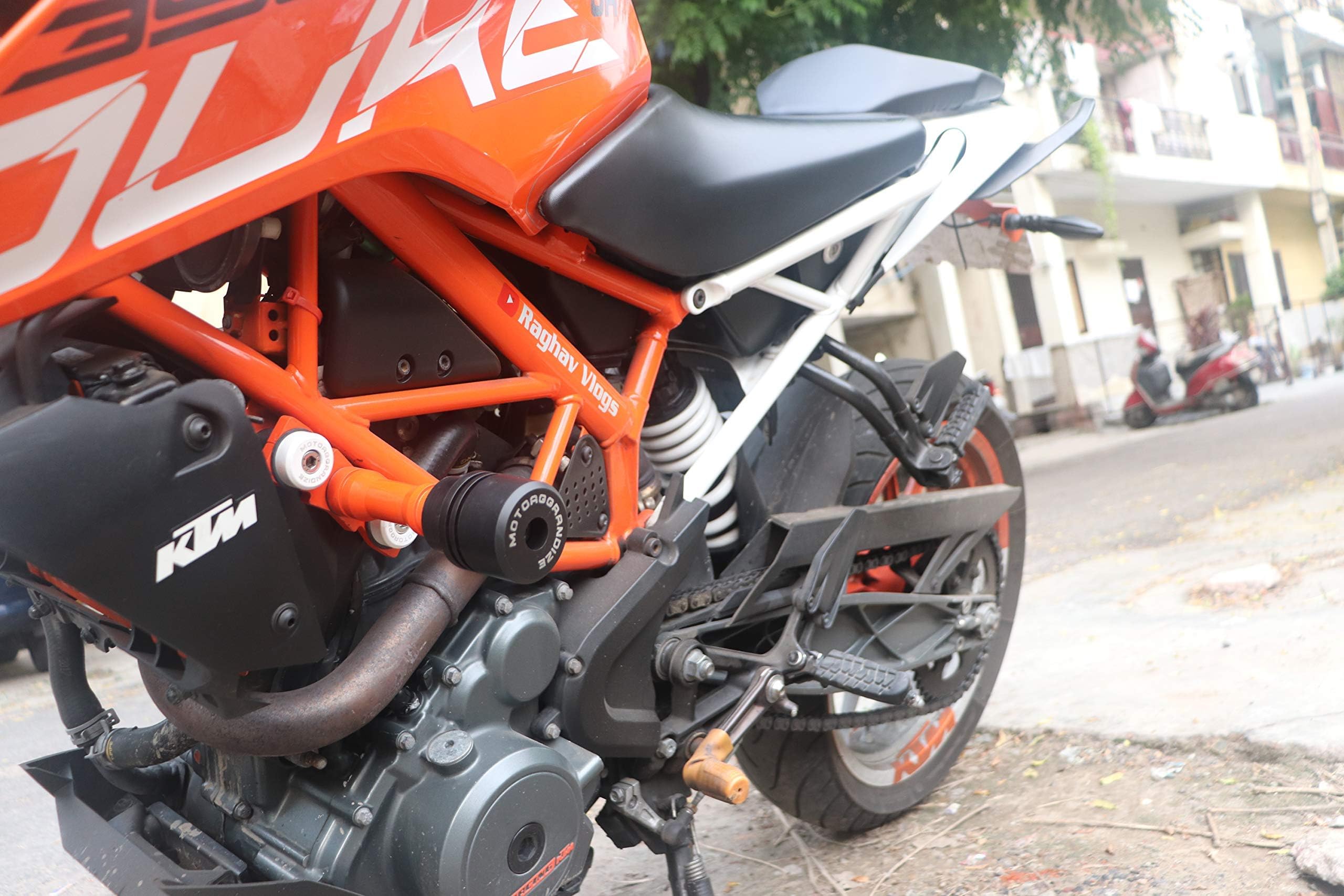 Motoaggrandize Frame Sliders/Crash Protectors for KTM Duke 125/200/ 250/390 (Orange | White)