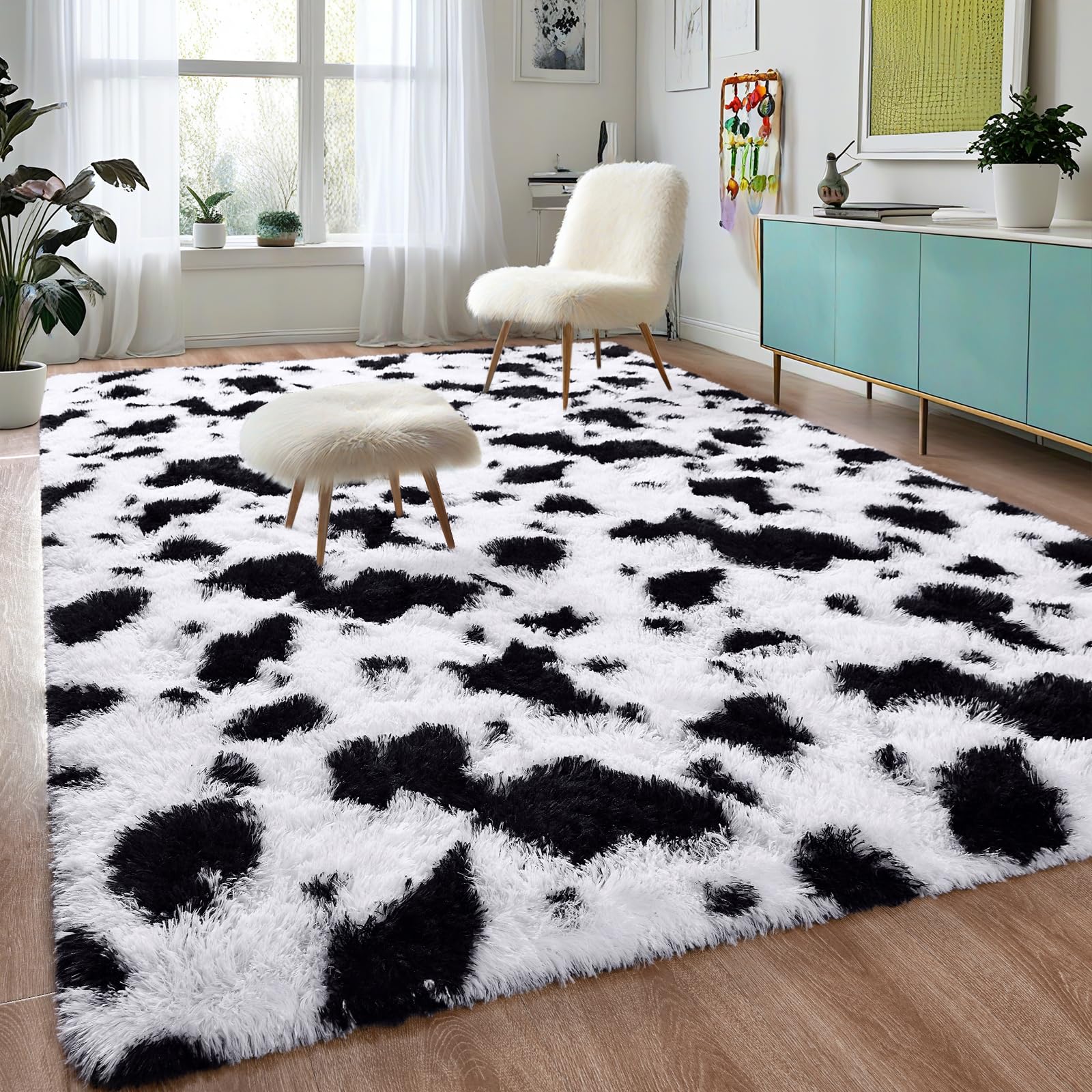 Photo 1 of DweIke Fluffy Black White Rugs for Bedroom Living Room, 5x8 Feet Soft Plush Shaggy Cow Hide Print Girls Boys Kids Rug, Non-Slip and Machine Washable Carpet for Dorm Nursery Classroom Decor