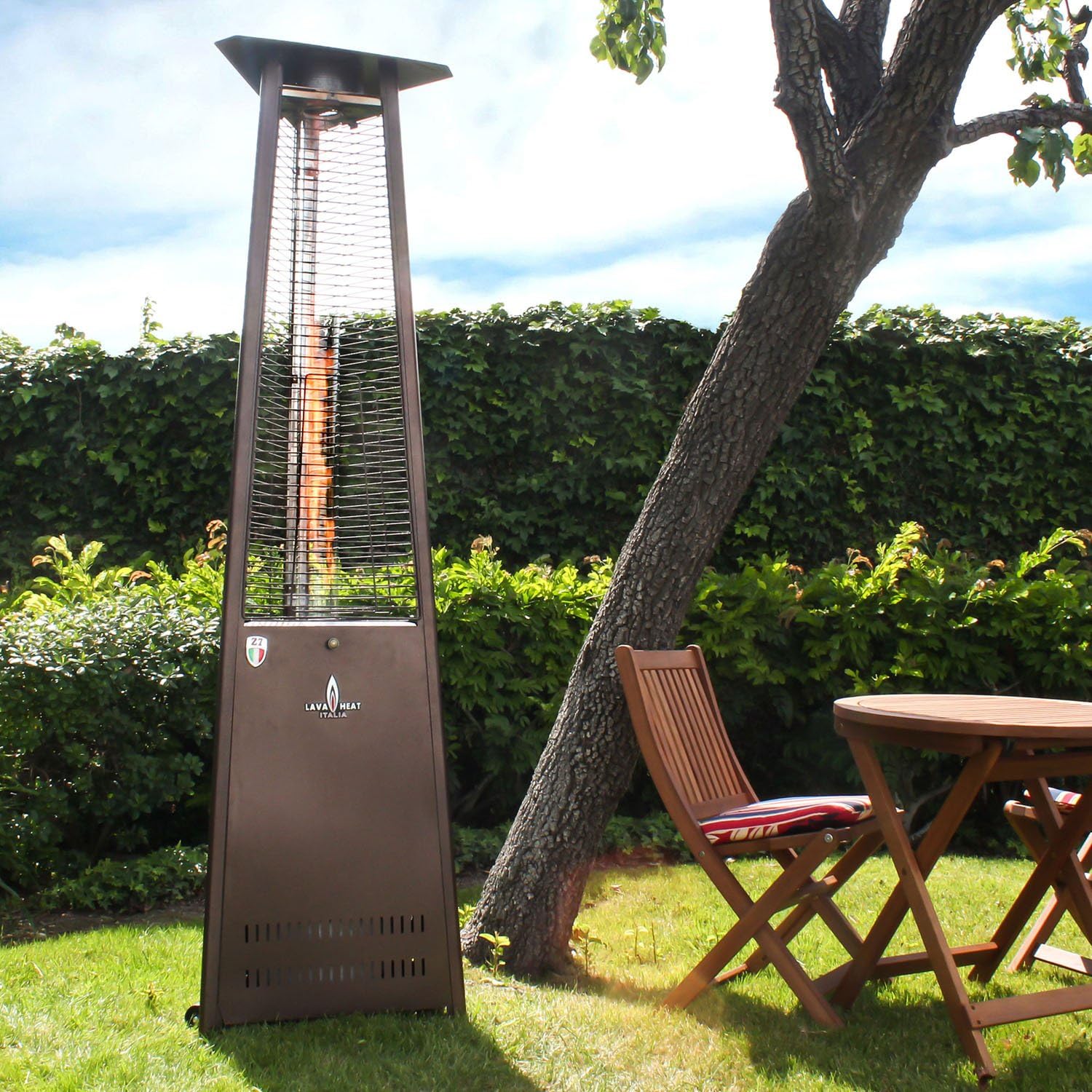 Lava Heat Italia 56,000 BTU Outdoor Patio Propane Tank Gas Heater with Specially Designed Borosilicate Shatter-Resistant Glass Tube, with “Easy Start” Electrical Ignition, Adjustable Flame and Heat Control, Safety "Tip-Over" Switch, Wheel Kit & Universal Infra-Red Remote Included, Heritage Bronze Finish