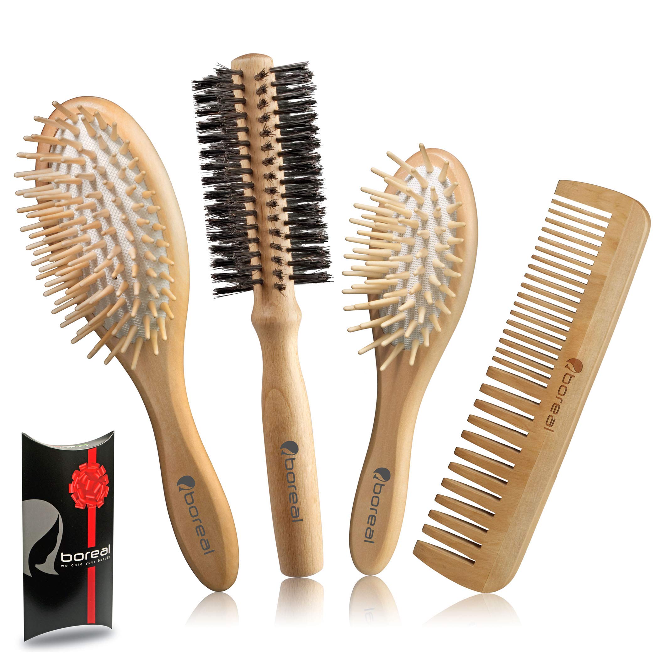 Hair brush set, natural wood consisting of: Pneumatic big model, pneumatic brush for woman purse, roller brush bristle fibres 57 mms. diameter, comb. All wrapped in an elegant gift box.