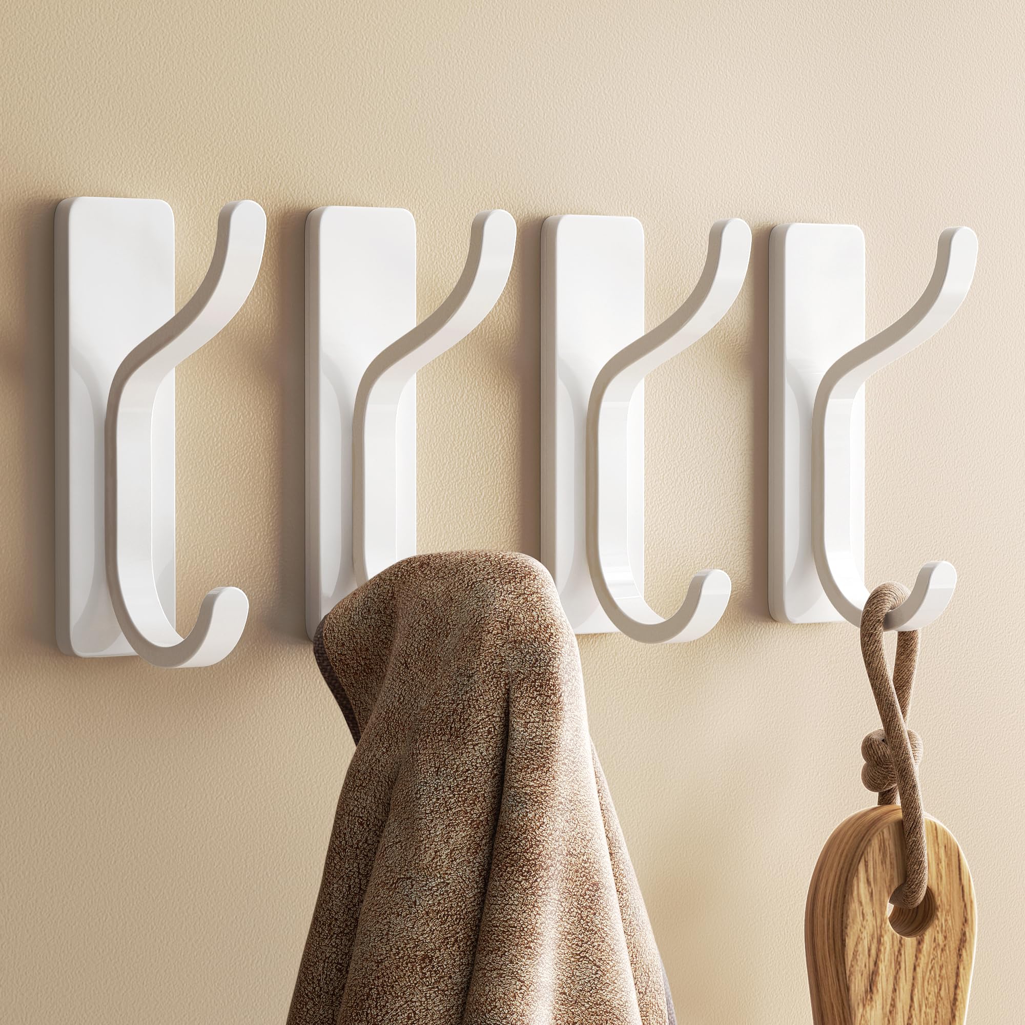 Photo 1 of Self Adhesive Wall Hooks for Hanging - 13 LB Strong Hold, Sticky Hangers for Coat, Towel, Purse, Keys, Bag - for Wall, Door, Bathroom, Shower, Kitchen - Stainless Metal, White, 4 Pack