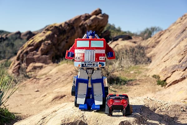 JADA TOYS – TRANSFORMERS OPTIMUS PRIME CONVERTING RC VEHICLE – KIDS TOYS GIFT WITH TRANSFORMATION FROM TRUCK TO ROBOT – LIGHTS & SOUNDS – FULL FUNCTION REMOTE CONTROL – 13″ LONG