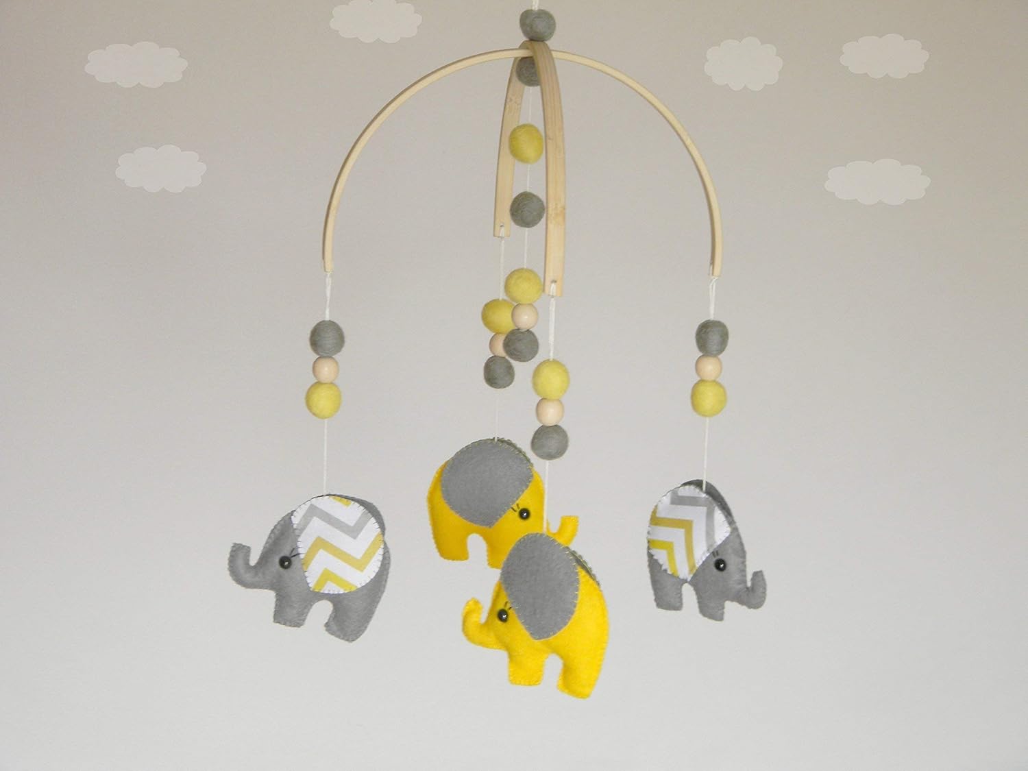 grey and yellow cot mobile