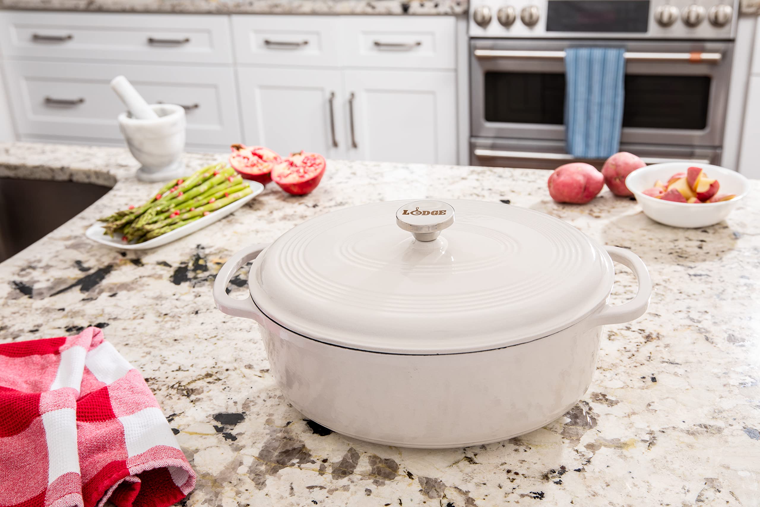 Lodge 7 Quart Enameled Cast Iron Oval Dutch Oven with Lid – Dual Handles – Oven Safe up to 500° F or on Stovetop - Use to Marinate, Cook, Bake, Refrigerate and Serve – Oyster White