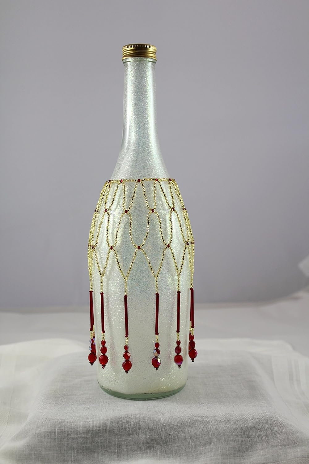 Beaded red and gold wine bottle beads. Handmade