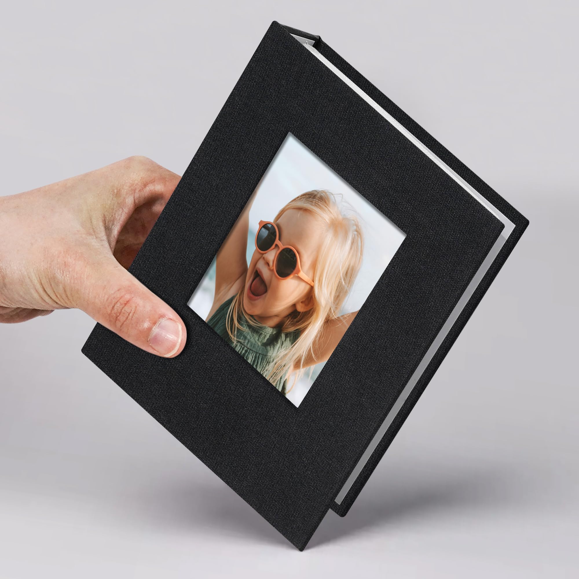 Photo 1 of Vienrose Small Photo Album 4x6 Slip-in Picture Album 50 Pages Holds 100 Photos, Portable Photo Book 4x6 for Wedding Family Baby Travel Black