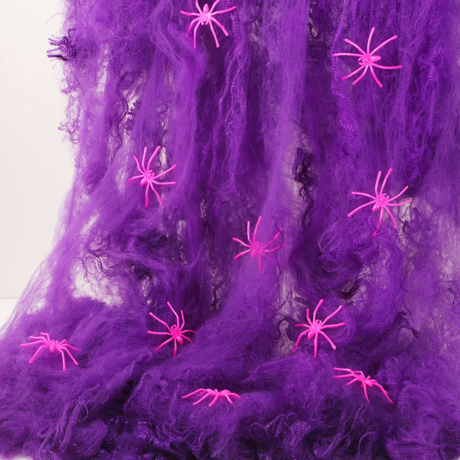 Photo 1 of 240g Glow in The Dark Spider Web and 150 Pcs Halloween Glow Fake Spider Stretch Spider Webs Halloween Decoration Cobwebs for Creepy Halloween Home and Party Indoor and Outdoor Decoration(Purple)