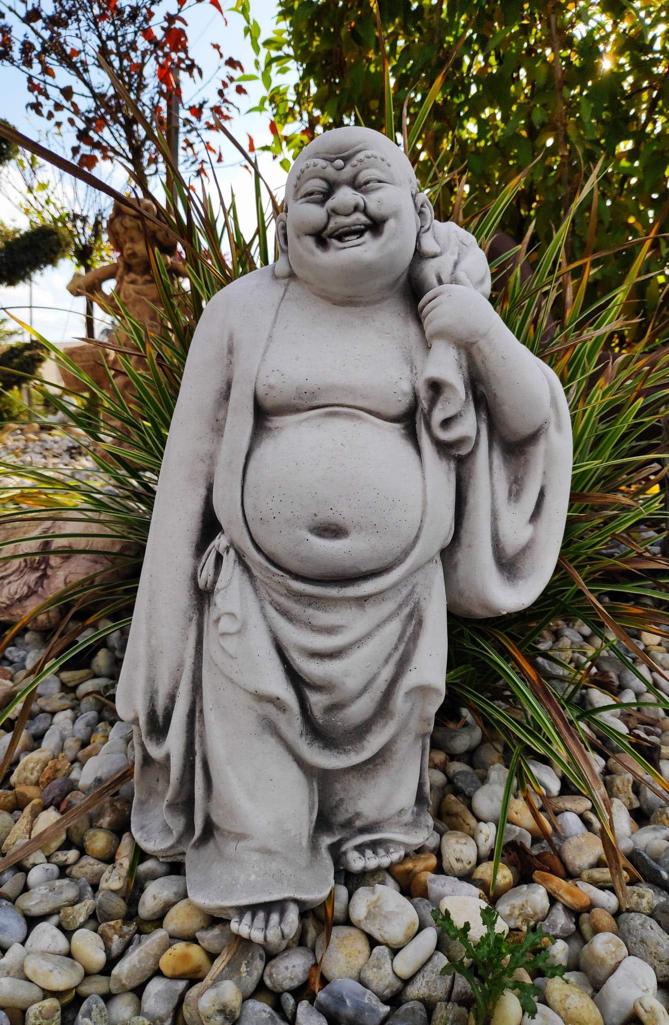 Cast stone statue of Joyful travelling Buddha for garden