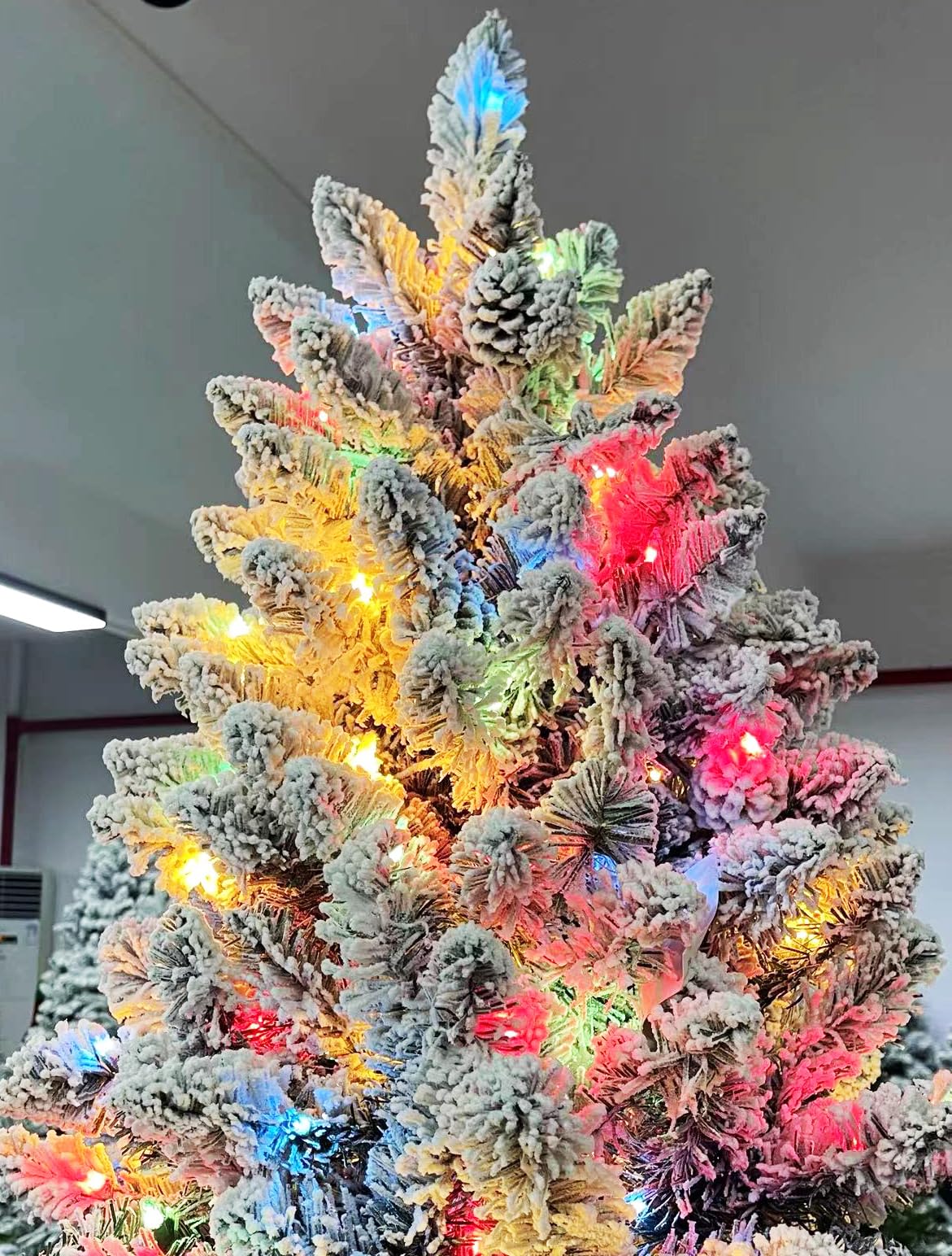 7FT Pre-Lit Christmas Tree with 500 Multicolor Lights, Realistic Snow Flocked Artificial Pine Trees with Pine Cones & Premium PVC, Sturdy Foldable Metal Stand, Easy Assembly Hinged Design