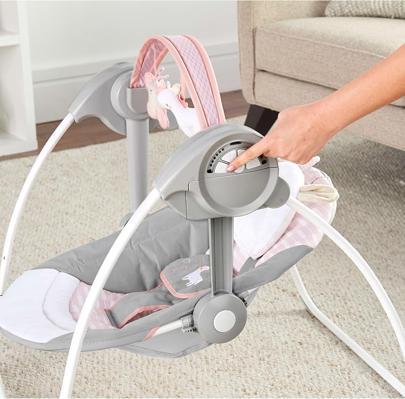 , Columpio Compacto y Plegable Flora el Unicornio, 6 velocidades de balanceo, temporizador, 12 melodías, arco de juegos extraíble, rosa, desde recién nacido hasta los 9 kg, 1 Unidad