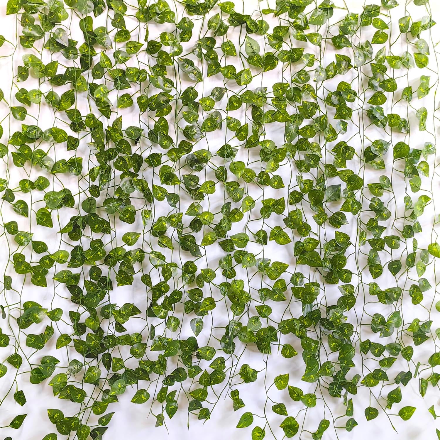 Photo 1 of 12 Pack Fake Vines for Room Decor Artificial Ivy Greenery Garland Hanging Plants Backdrop Faux Greenery Leaves for Bedroom Home Garden Wall Jungle Theme Party Wedding Decor