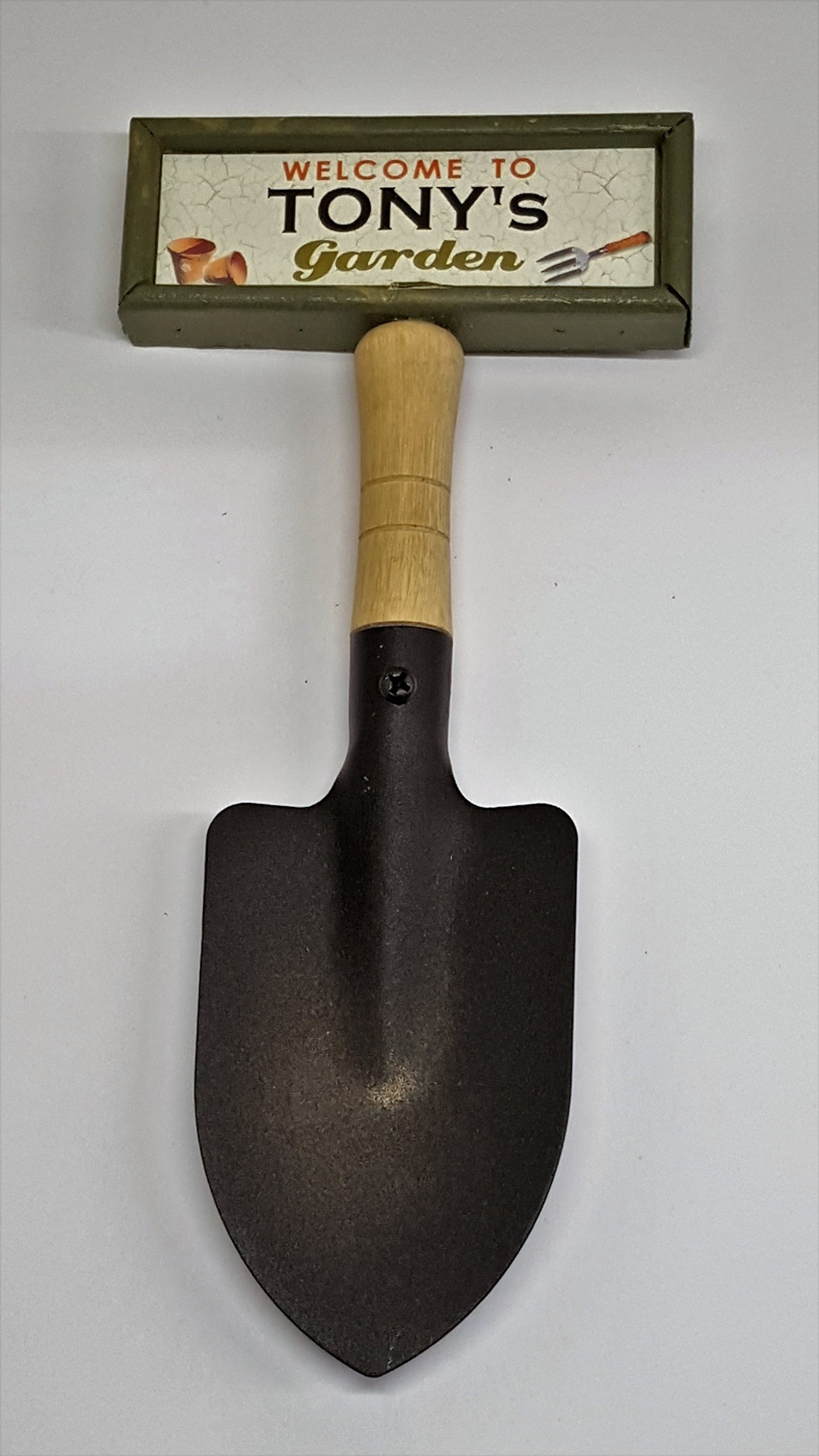 "Welcome to Tony's garden" hanging shovel sign