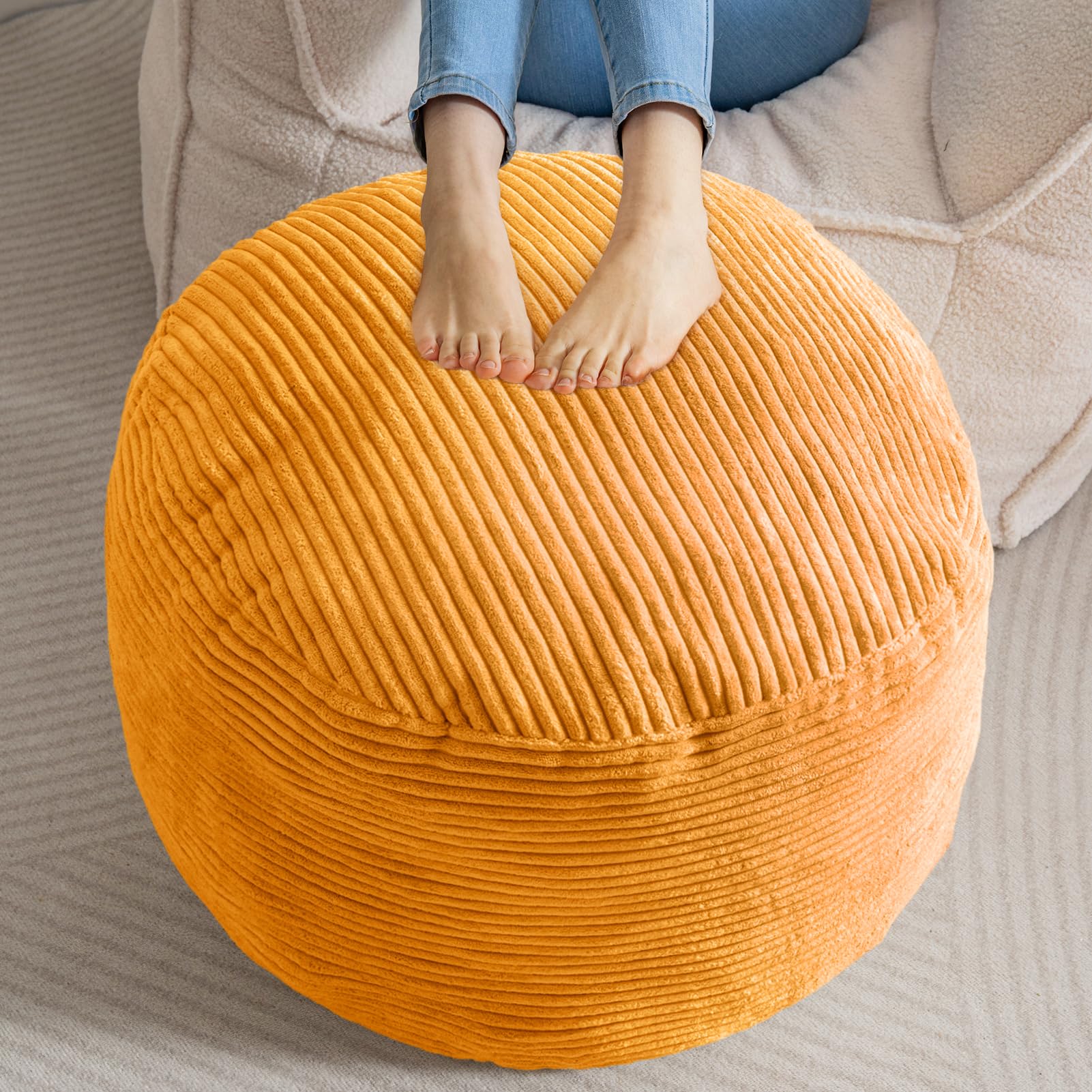 Photo 1 of HIGOGOGO Round Stuffed Pouf Ottoman, Corduroy Poufs with Foam Chunk Filling, Furry and Fluffy Pouf Foot Stool Storage Ottoman, 26 X 18 Floor Poufs Foot Rest for Living Room, Orange