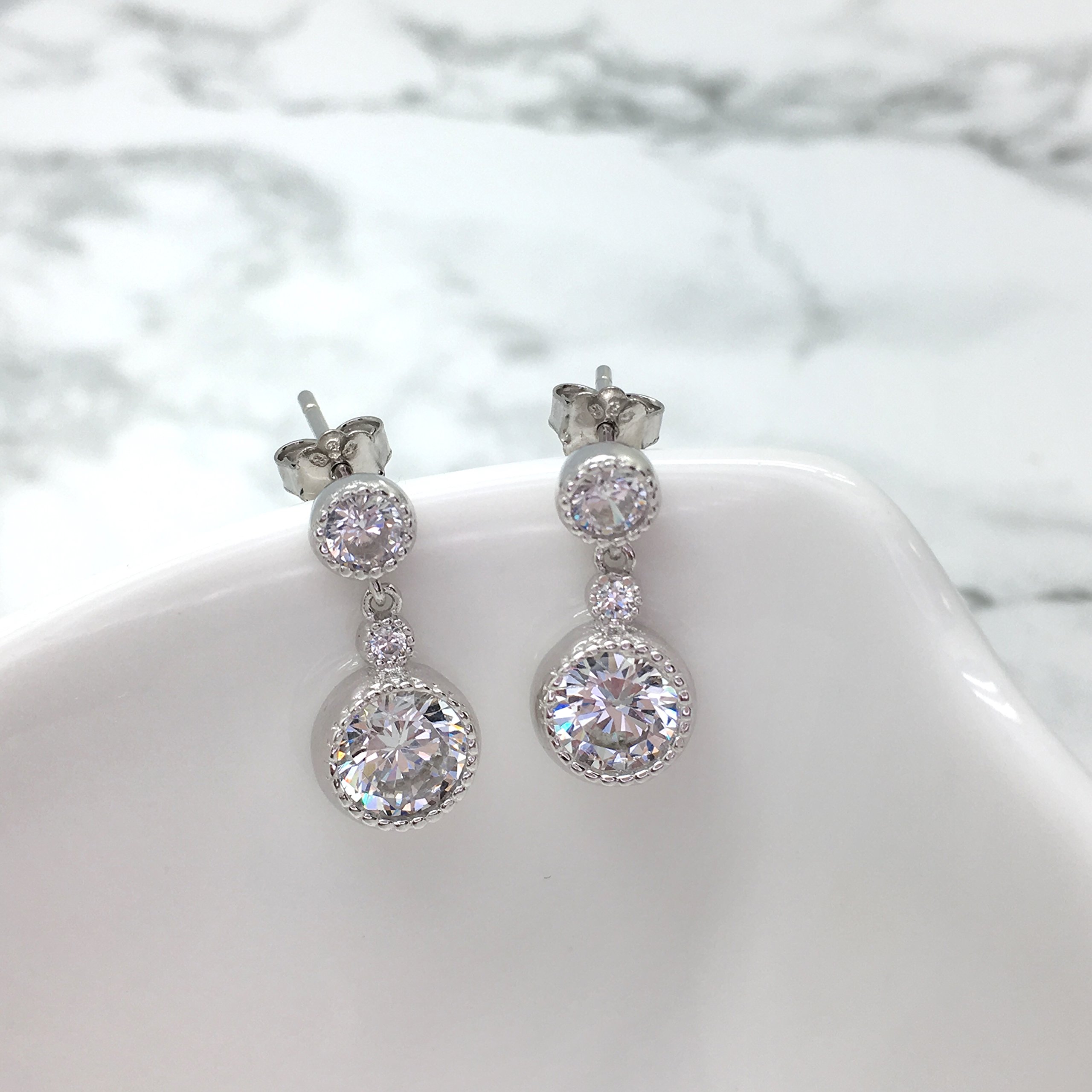 Spoil Cupid Rhodium Plated Sterling Silver Cubic Zirconia Milgrain Dangle Drop Earrings