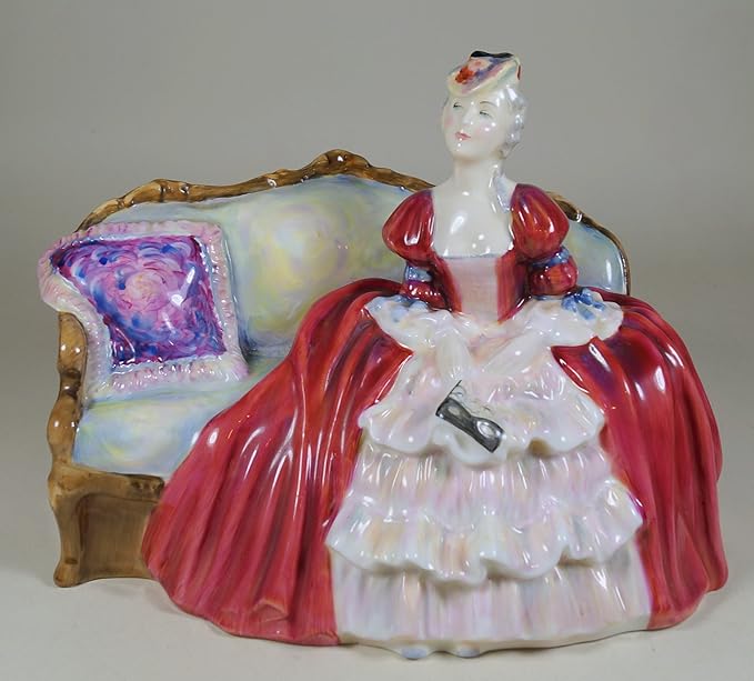 A Royal Doulton Figure Figurine Belle O' The Ball Lady Seated On Couch